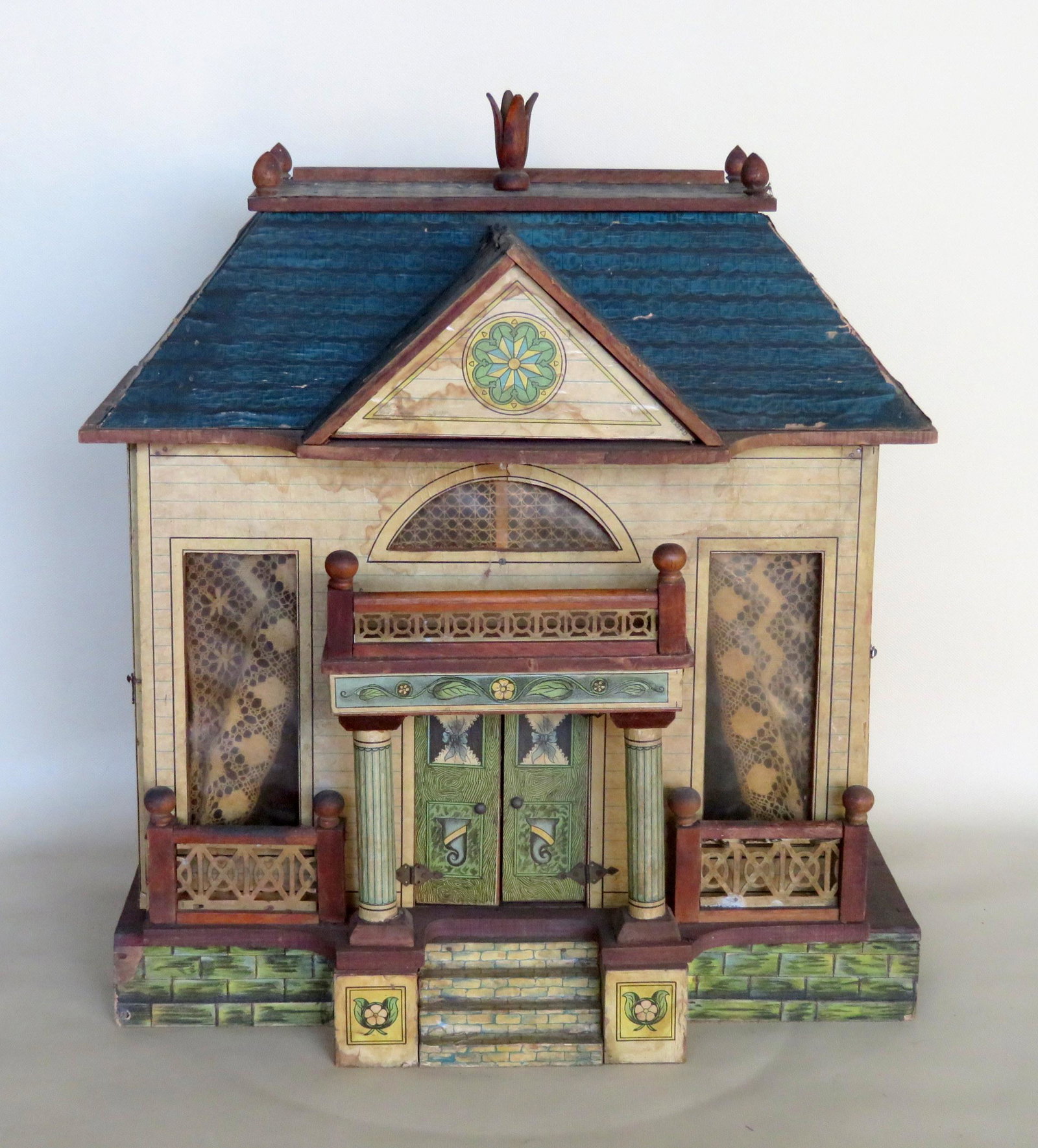 Bliss lithographed wooden doll house with balcony and: Bliss lithographed wooden doll house with balcony and mansard roof with finial, 19th century. The left and right sides open to expose large interior rooms with curtains - the front double doors also o