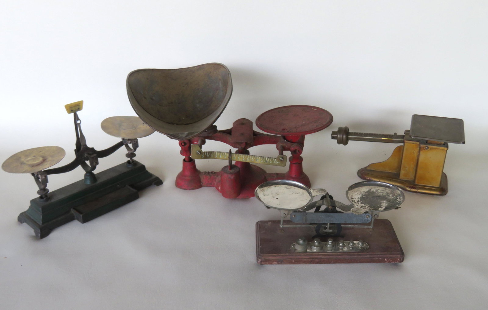Grouping of 4 table top scales, late 19th to early 20th: Grouping of 4 table top country scales, late 19th to early 20th century. 1) Brass and tin gold painted scale signed Triner Scale & Mfg. Co. - good working condition; 2)Gold scale marked "No. 8 Rexo Sc