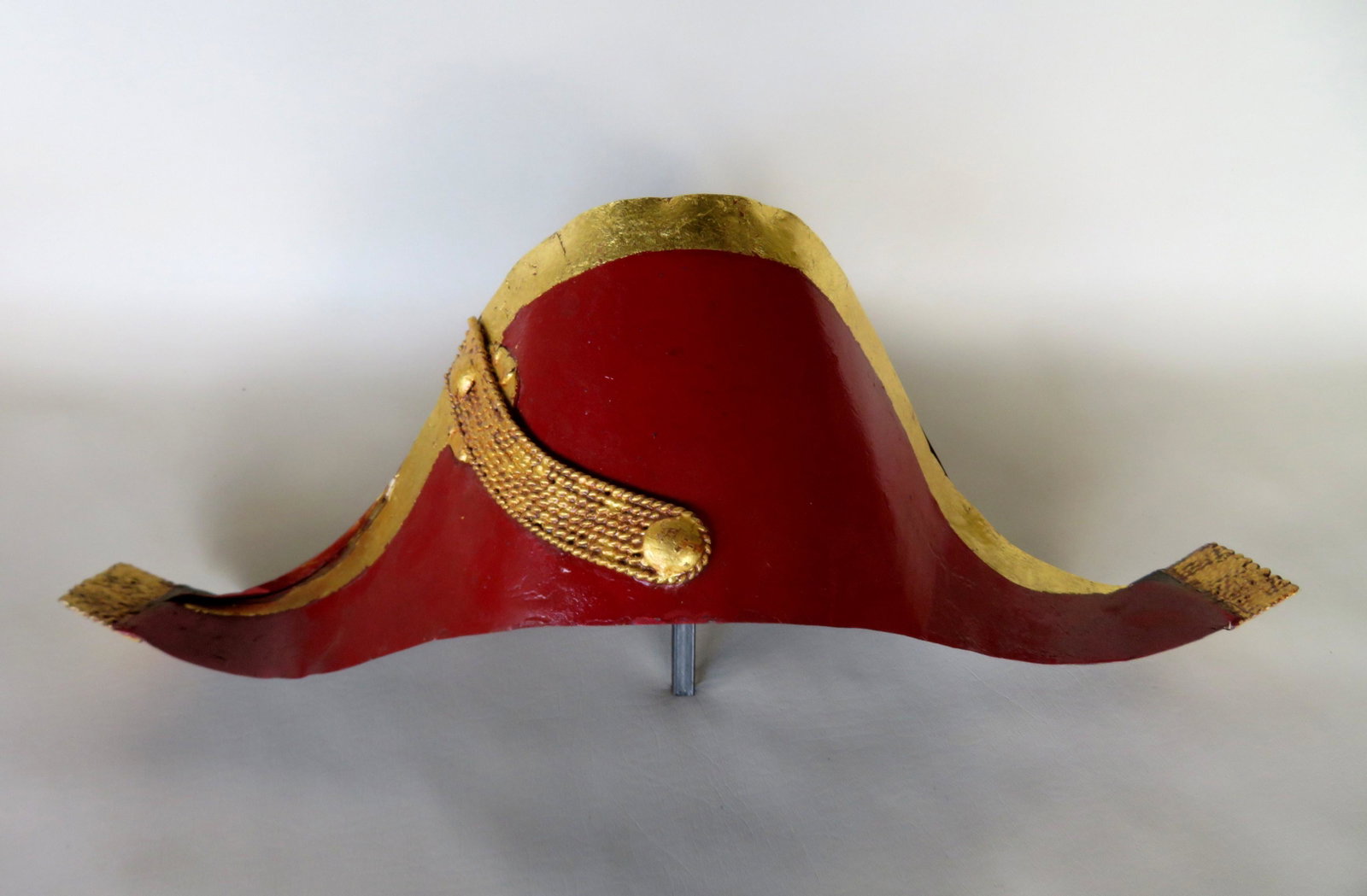 A French toleware bicorne military hat trade store sign: A French toleware bicorne military hat trade store sign with hand made iron rack for hanging on wall. Repainted otherwise very good condition. Unsure of age due to repaint but probably early 20th cent