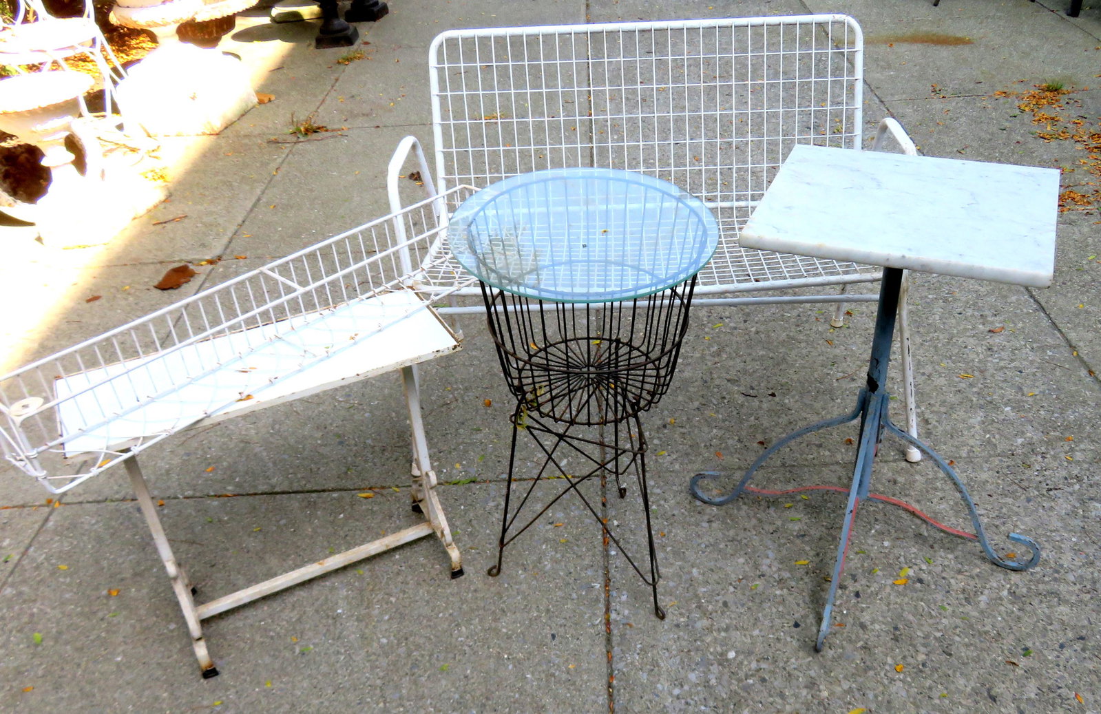 Grouping of garden furniture including: A wire settee: Grouping of garden furniture including: A wire settee with tubular frame - 42"L x 25"D x 31"H, 2 plant stands, a long wire basket and a modern wire floor standing basket probably from a department sto
