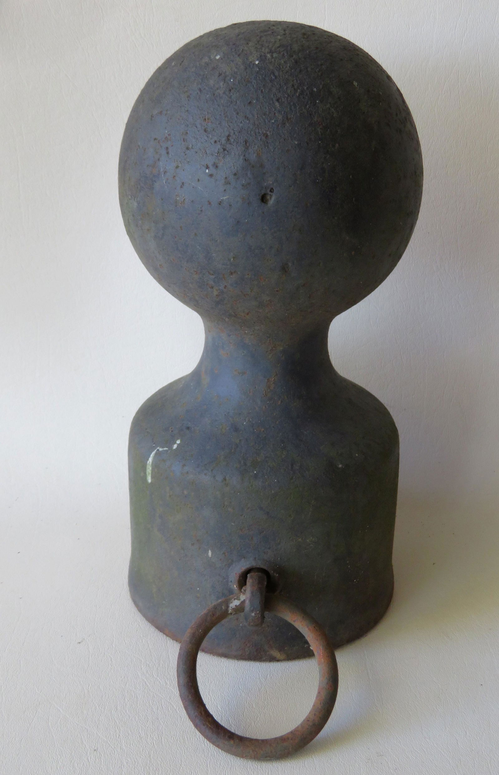 Cast iron horse hitching post with cannon ball finial,: Cast iron horse hitching post with cannon ball finial, late 19th to early 20th century. 12 1/2"H x 6 1.2"D. Very good condition.