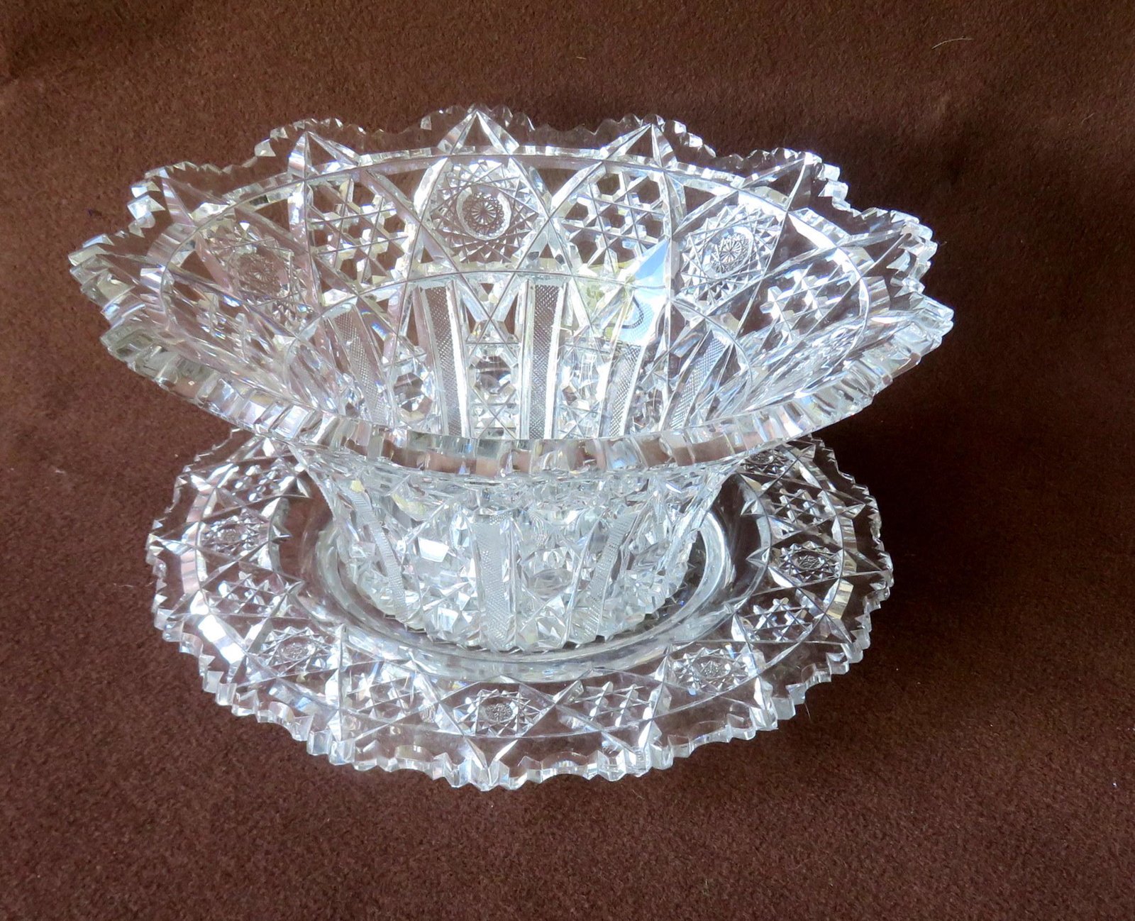 High quality cut glass bowl and under plate - the bowl: High quality cut glass bowl and under plate - the bowl measures 11 7/8"D x 5"H - Plate 11 1/2" dia. - both in very good condition. Provenance: From the Stanley Blum estate, Rhinebeck NY.