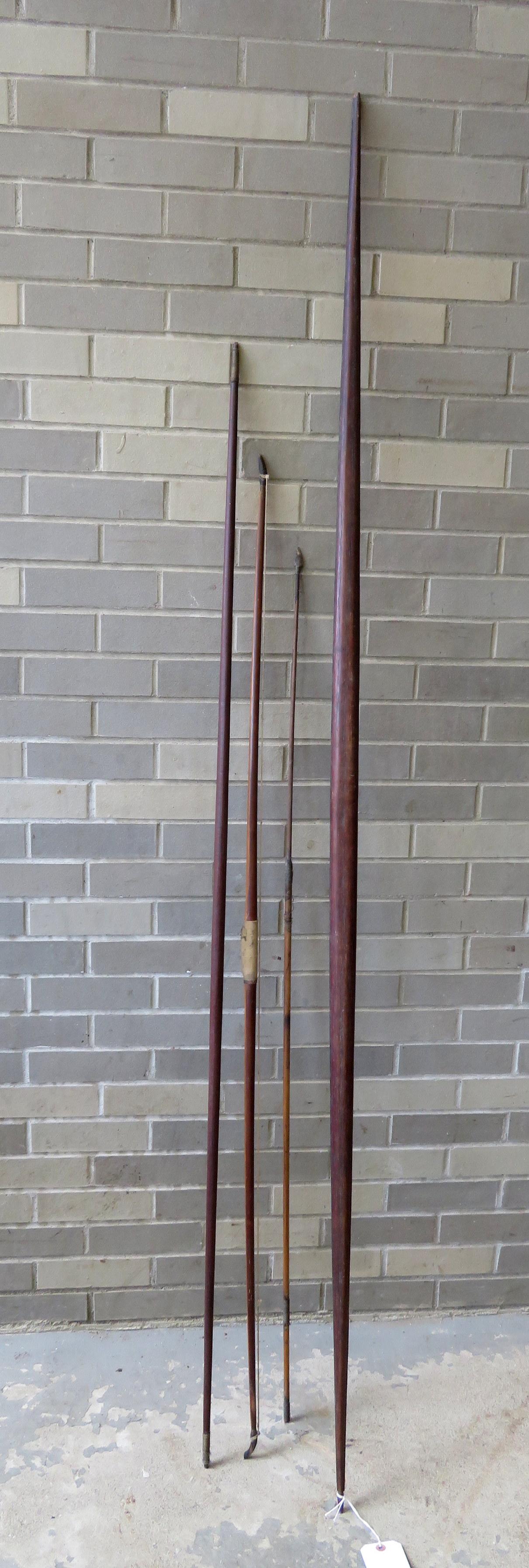 Three old bows and 1 arrow with flint point - all: Three old bows and 1 arrow with flint point - all appear to be hand made. Two bows are very primitive and tribal, unknown origin, 19th century (one with losses on end) - the other bow is signed "Horsm