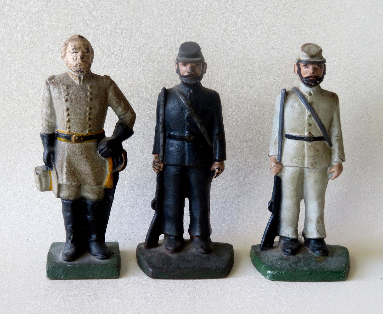 Three cast iron door stops in the form of General Lee: Three cast iron door stops in the form of General Lee and a union and confederate soldier. All in original paint and in good condition. Each approximately 7 1/2"H.
