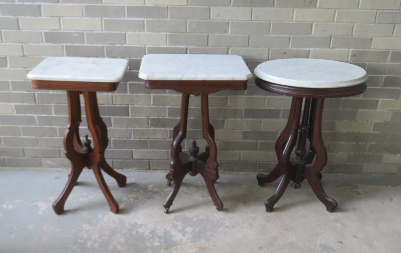 Three small Victorian marble top lamp tables, late 19th: Three small Victorian marble top lamp tables, late 19th century. The largest with oval top measures 21"L x 15"D x 29"H. All 3 in very good condition. Provenance: From the Stanley Blum estate, Rhinebec