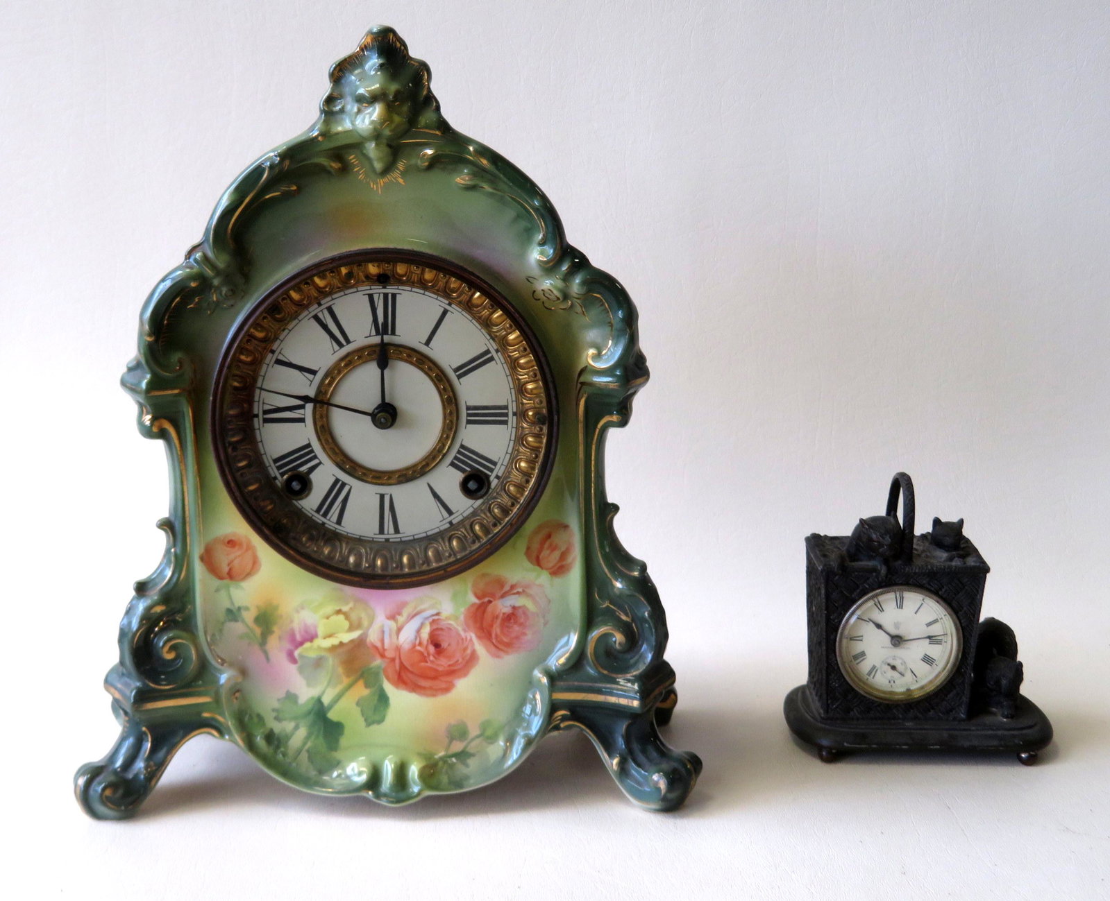 Two vintage clocks: 1) German porcelain shelf clock: Two vintage clocks: 1) German porcelain shelf clock marked "Royal Bonn / Germany / La Rambla" - The brass works signed Ansonia New York. Slight crazing, else very good condition - Please note, while t