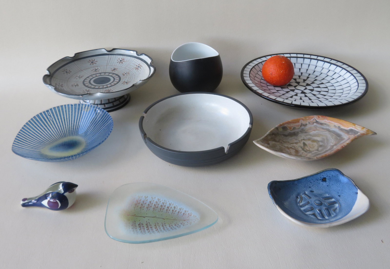 Grouping of mid century art pottery and glass objects: Grouping of mid century art pottery and glass objects including: A porcelain bowl designed by Raymond Loewy for Continental China - Germany - 4"H x 5"W; a porcelain ash tray/bowl signed Heath (Edith H