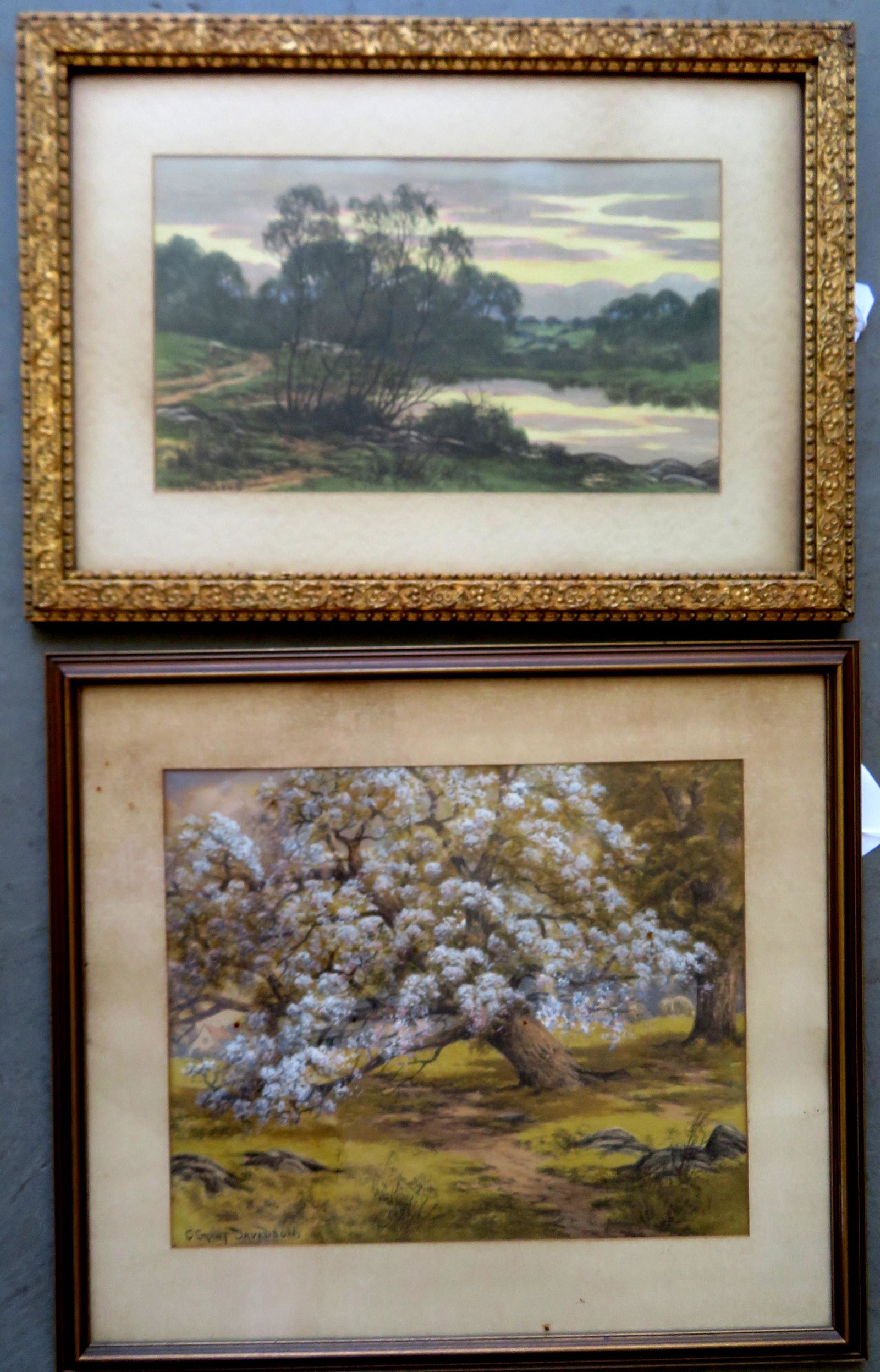 Charles Grant Davidson, NY, 1865-1945. Two watercolors: Charles Grant Davidson, NY, 1865-1945. Two watercolors including: Landscape of trees on the shore of pond with rolling hills in the background, signed C.G. Davidson - size within mat 9 3/4" x 16 3/4"