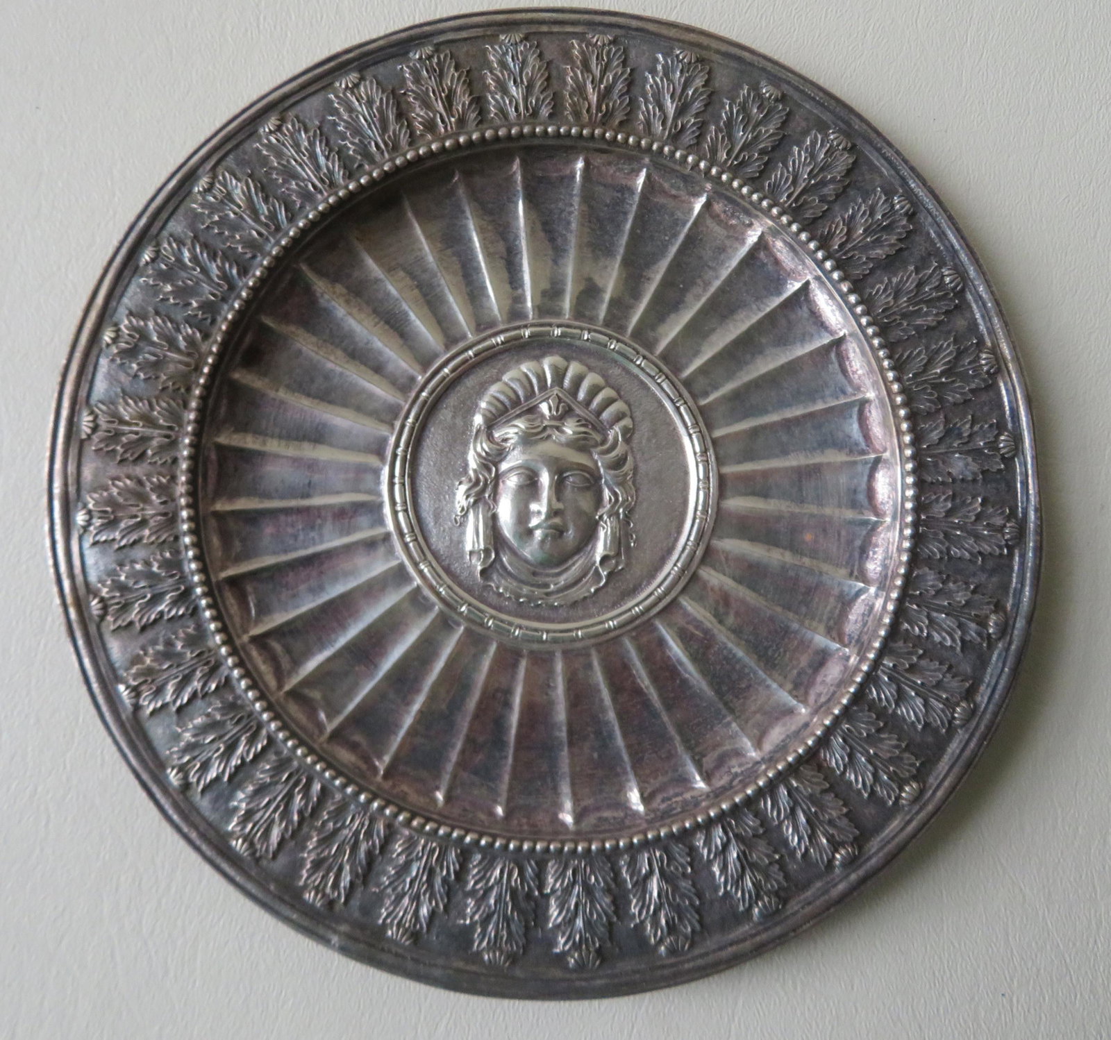 Edward F. Caldwell, NY (1851-1914), famous designer of: Edward F. Caldwell, NY (1851-1914), famous designer of lighting and fine decorative metal objects who opened his company in NYC in 1895. An ornate and artful silver plate having a central figure of a 