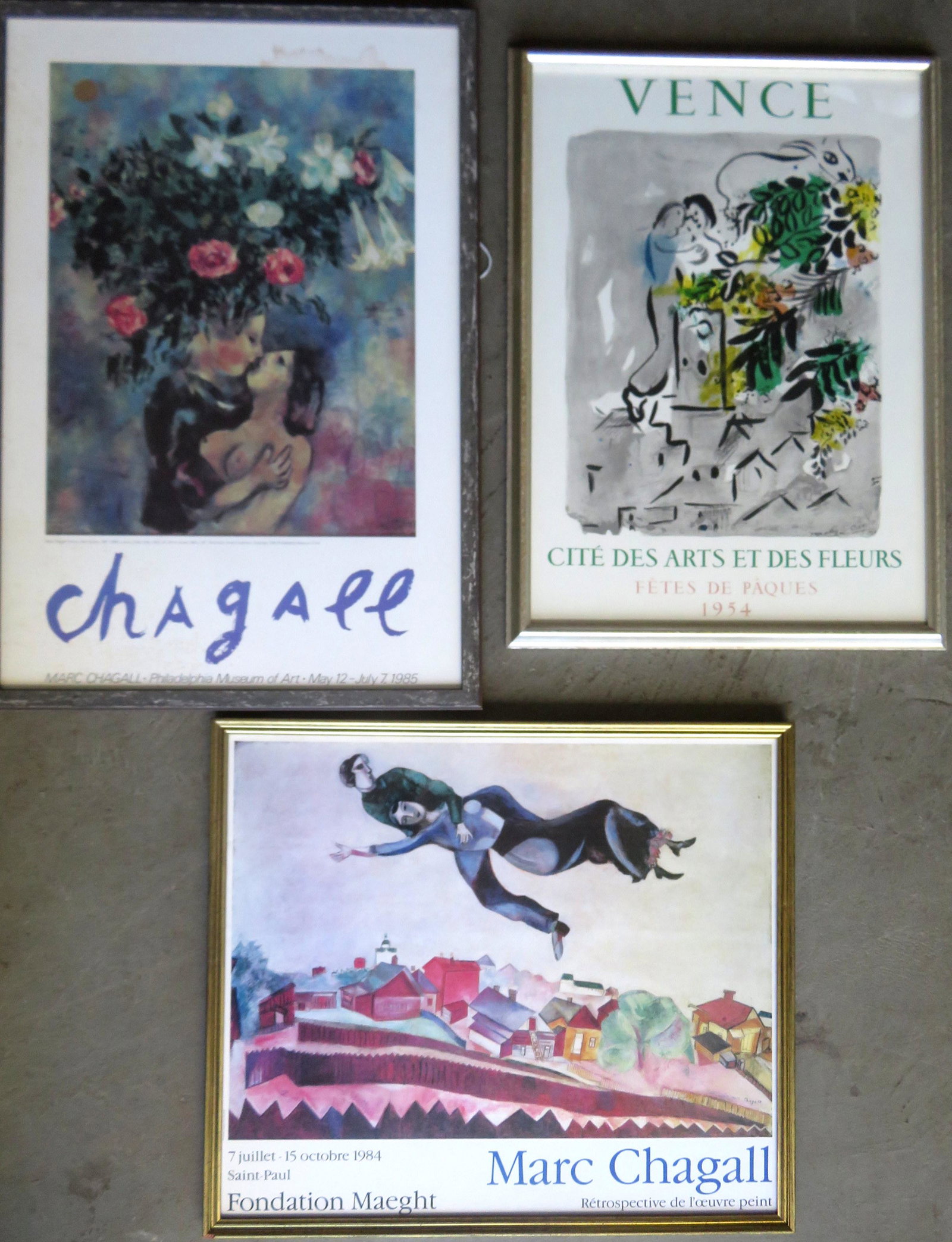 Grouping of 3 Marc Chagall lithograph posters, all with: Grouping of 3 Marc Chagall lithograph posters, all with printed signatures. â€œVence” with printed dated of 1954 â€“ in very good condition, the other 2 museum posters from the 1980â��