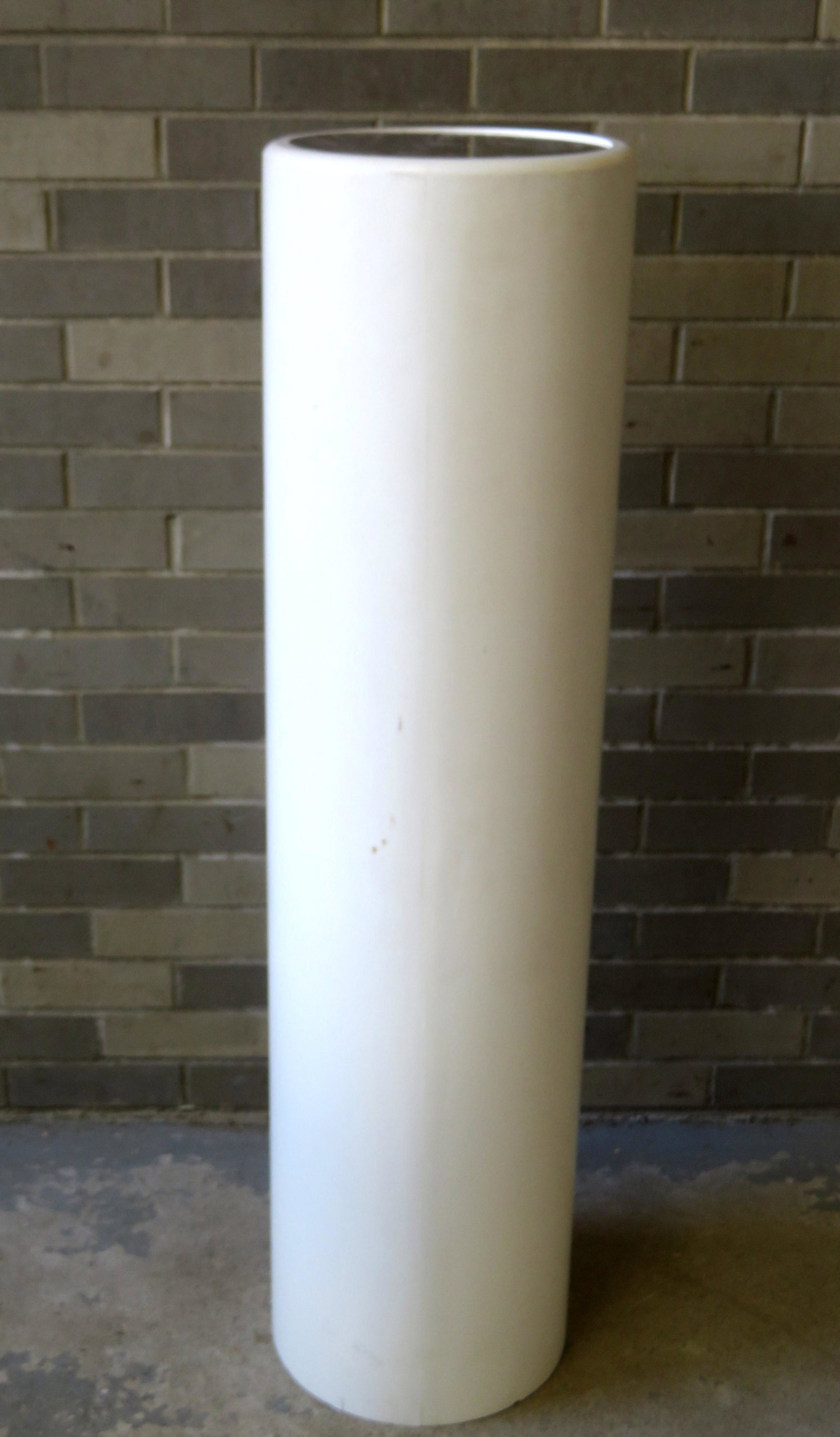 A modern pedestal with mirror top, fabric covered: A modern pedestal with mirror top, fabric covered plyboard cylinder in original white paint, late 20th century. 12" dia. X 46"H. Minor use wear and overall very good condition.