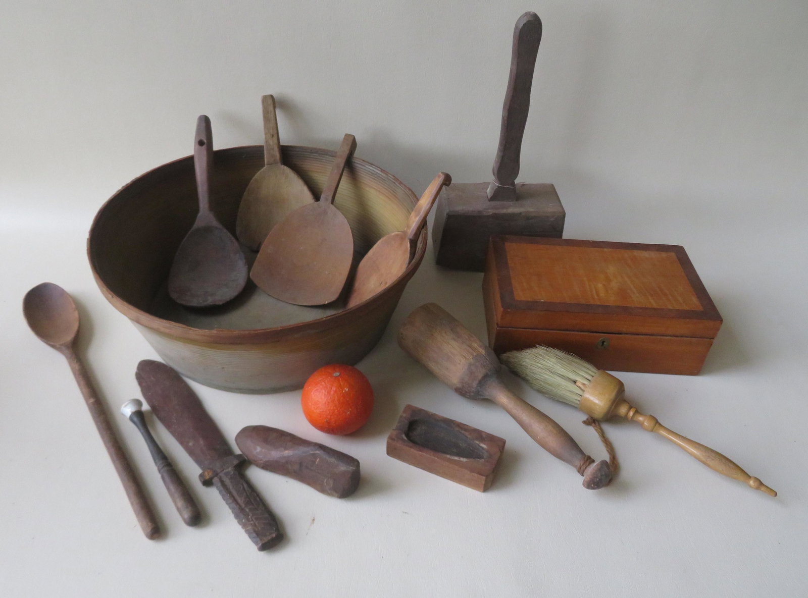 Grouping of country items: Grouping of country items including a Shaker style brush signed Whiting-Adam, tiger maple dresser box, primitive wooden mallet, carved toy dagger dated 1903, 4 wooden scoops, other kitchenware, and a 