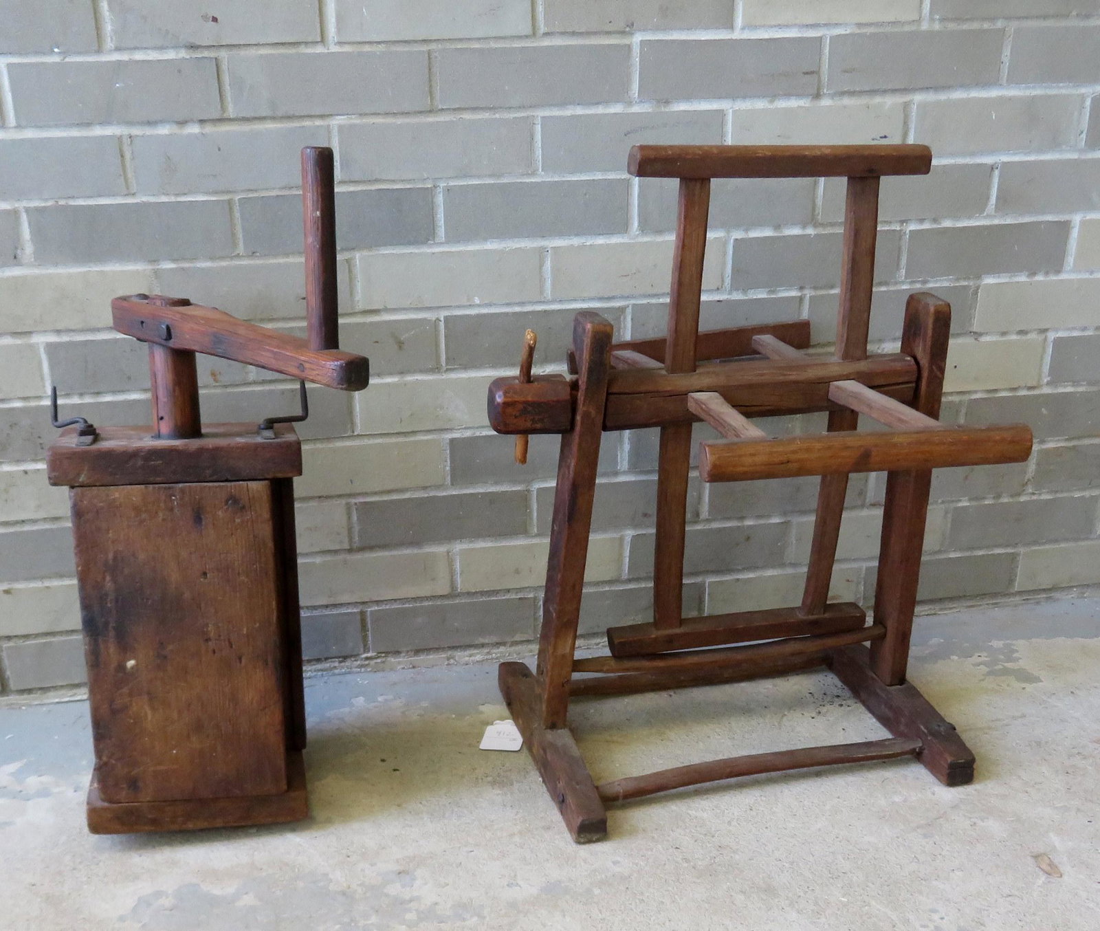 Two primitive wooden hand made pieces of household: Two primitive wooden hand made pieces of household machinery, late 18th to early 19th century including: A hand crank machine possibly for making sausage - hand forged iron hardware attached to hand m