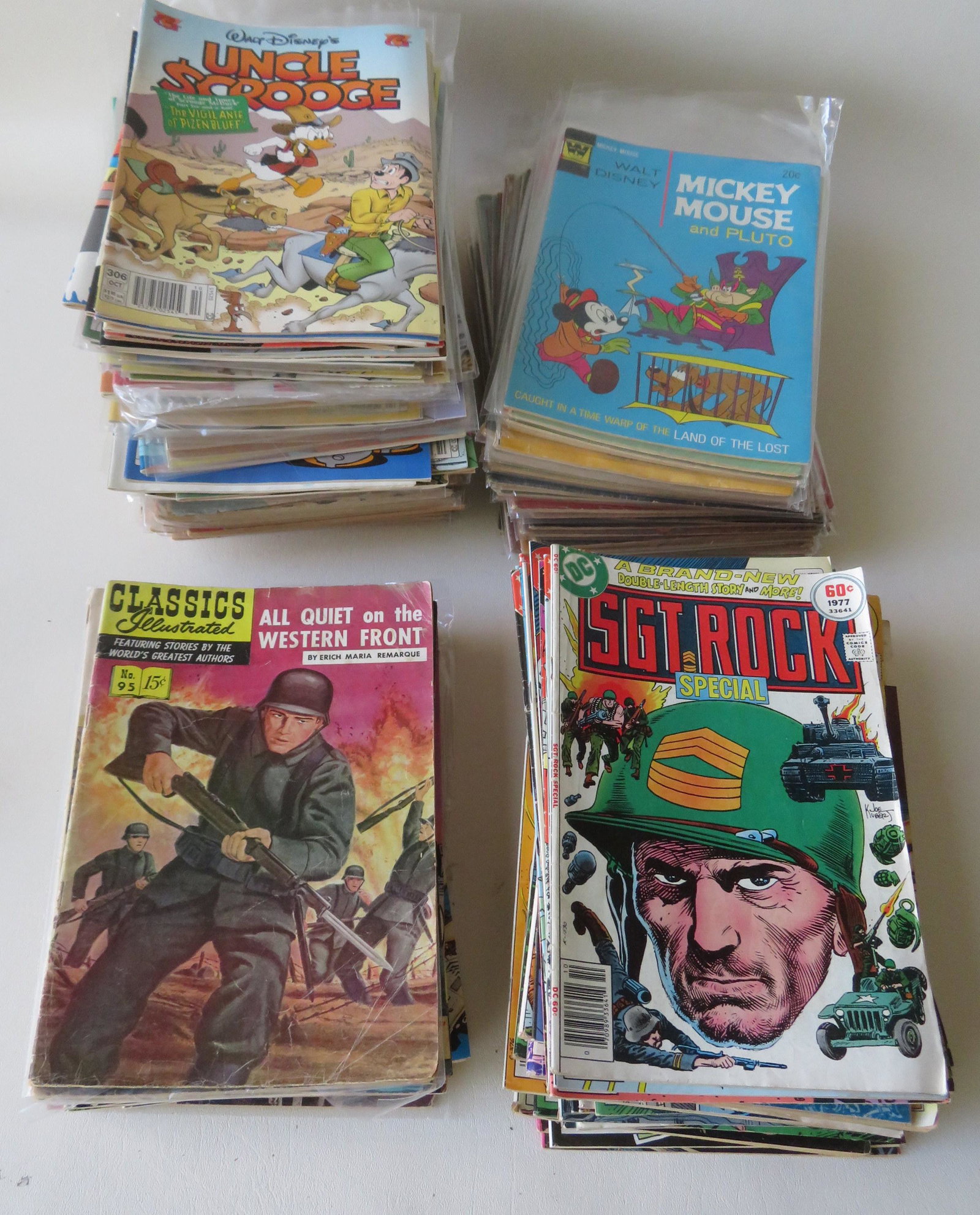 Grouping of over 235 vintage comics - Funnies,: Grouping of over 235 vintage comics - Funnies, Military, and Action, including: 27 Donald Duck / Huey-Dewey-Louie / and Uncle Scrooge (25 of these are 10 cents and 2 are 15 cents); one 10 cent Mickey 