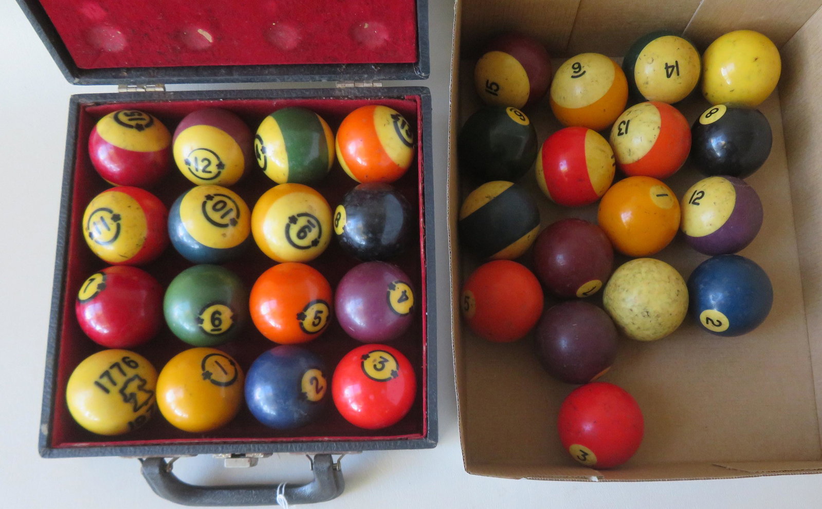 Two sets of vintage billiard balls including: A: Two sets of vintage billiard balls including: A complete boxed set of 16 balls - the box marked "Albany Hyatt Billiard Ball Co. / Made in U.S.A."; and an unboxed complete set of 16 balls, all in good 