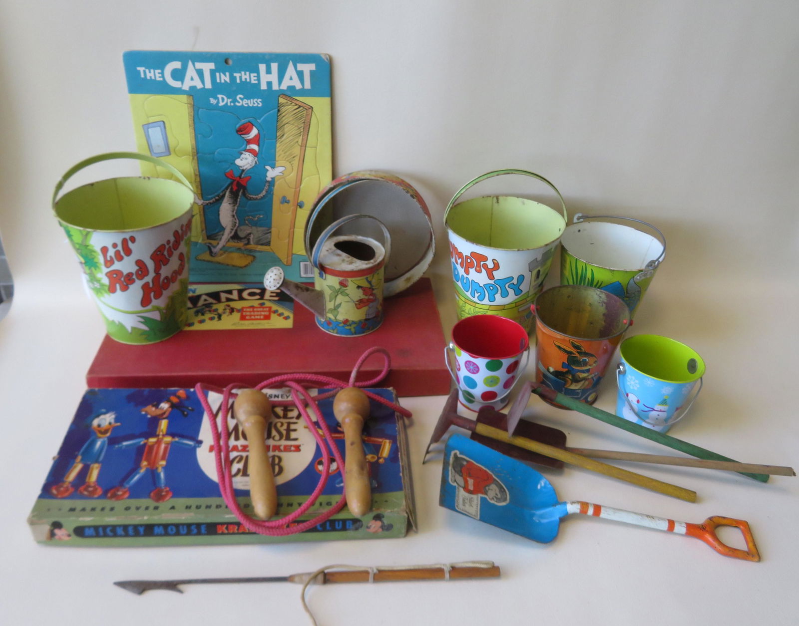 Grouping of tin sand toys, and games, most circa: Grouping of tin sand toys, and games, most circa 1950-70, including: Mickey Mouse Krazy Ikes Club - 1955 - original box with parts (has not been checked for completeness); Parker Brothers Finance boar