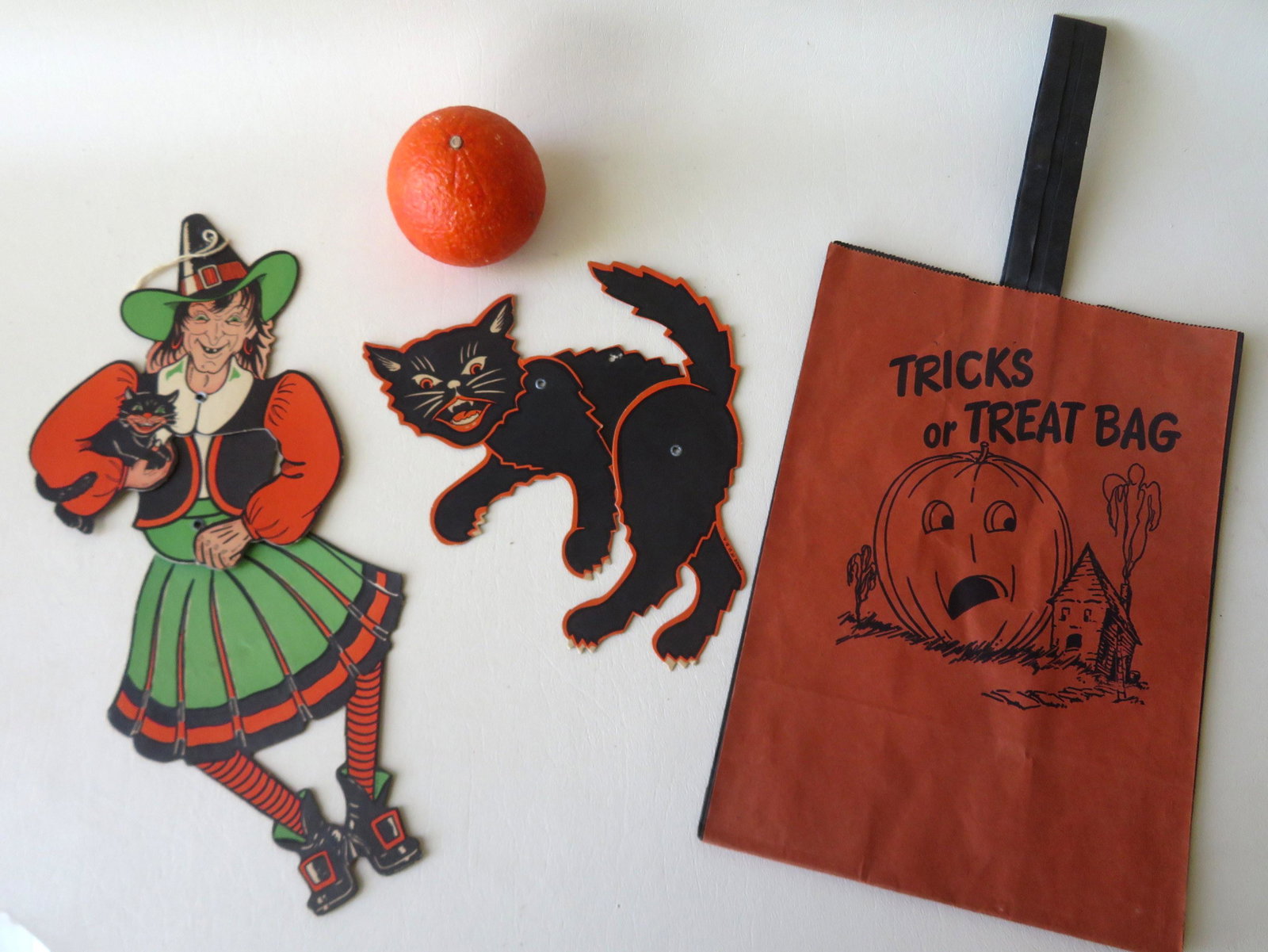 Three vintage paper Halloween decorations including an: Three vintage paper Halloween decorations including an articulated black cat marked Made in U.S.A. - excellent condition; an articulated witch holding cat marked Made in U.S.A. - excellent condition -