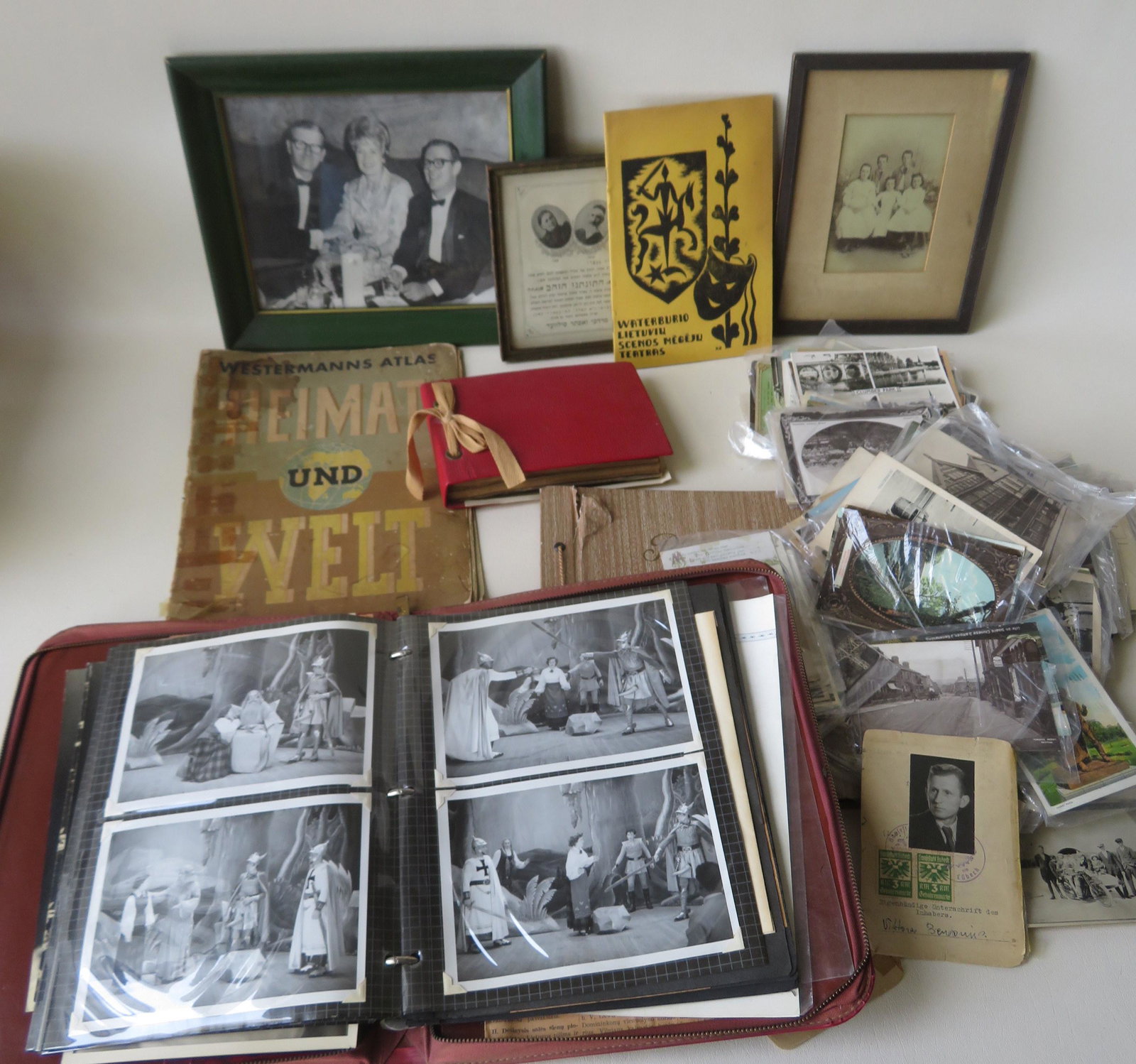 A grouping of ephemera related to a WWII European: A grouping of ephemera related to a WWII European family, most Baltic related, including one photo album with photos from a Displaced Persons Camp in Augusburg Germany - Baltic Camp - 1945; photo post