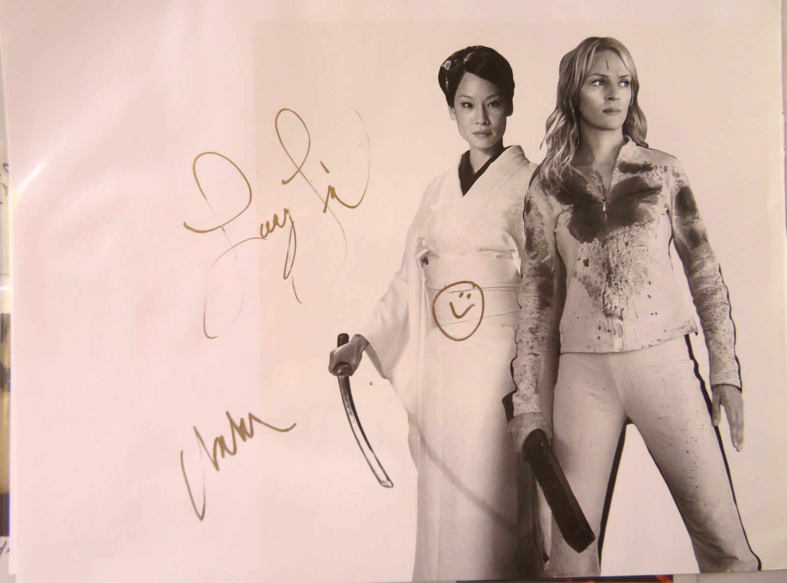 Grouping of over 55 Lucy Liu photos in color and black: Grouping of over 55 Lucy Liu photos in color and black and white, the largest 8" x 11", including several nudes and some press release photos. Eight of the photos with original autographs, including o