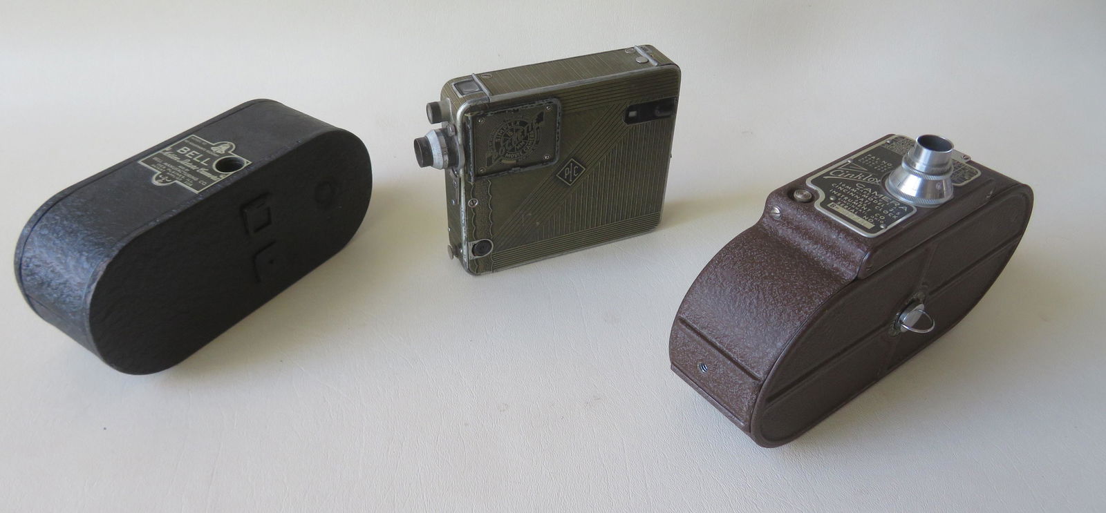 Early 16MM Movie Camera lot and projector consisting of: Early 16MM Movie Camera lot and projector consisting of a Bell model 10 Motion Picture Camera, a Simplex pocket 16 MM Movie Camera, and a Cinklox 16MM model 3-S. Also a Kodascope Model K porjector wit