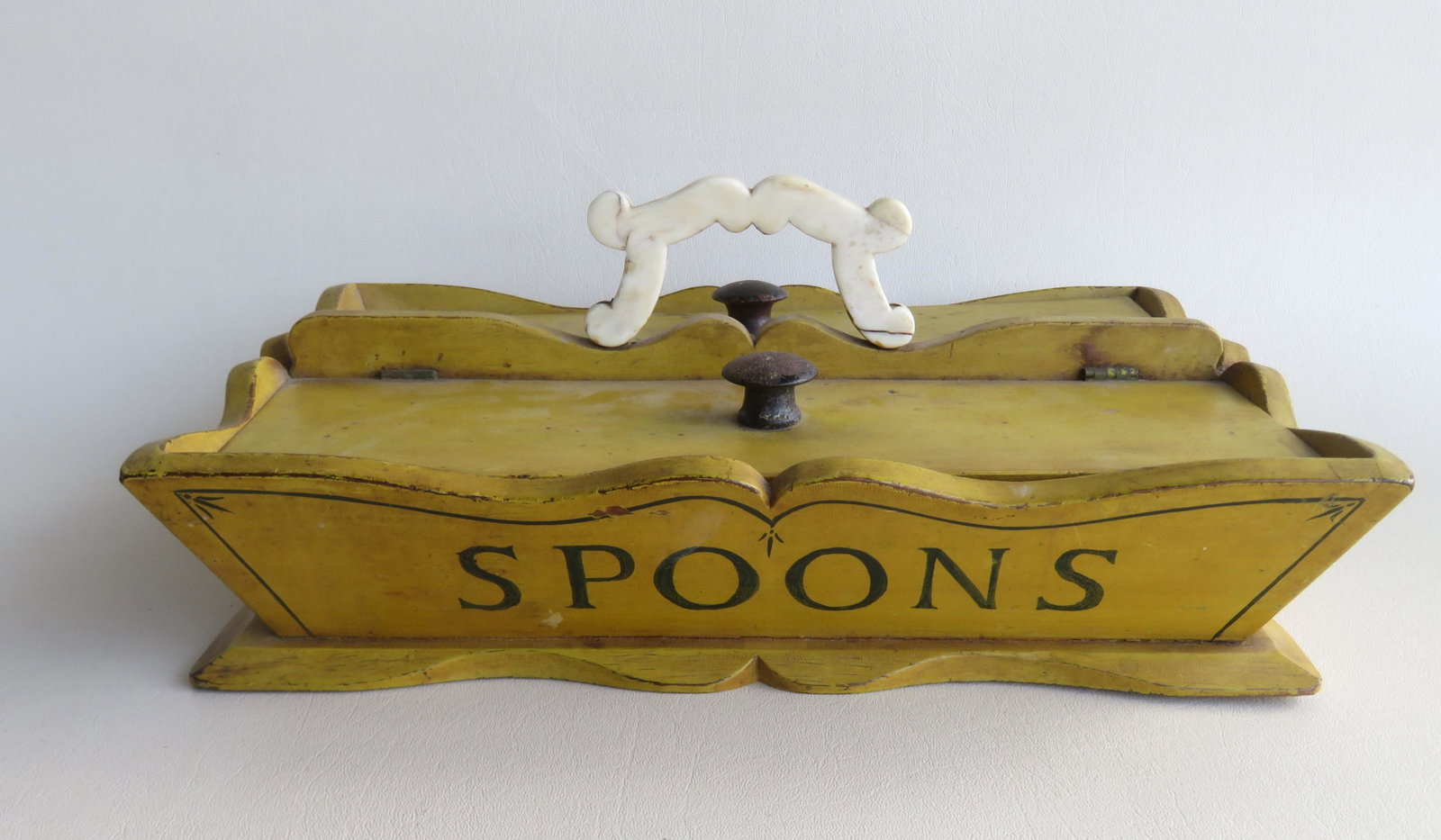 The best double sided cutlery box in original mustard: The best double sided cutlery box in original mustard paint, early to mid 19th century. It has a shaped bone handle and 2 lift storage areas for holding cutlery - the front and back sides are marked "