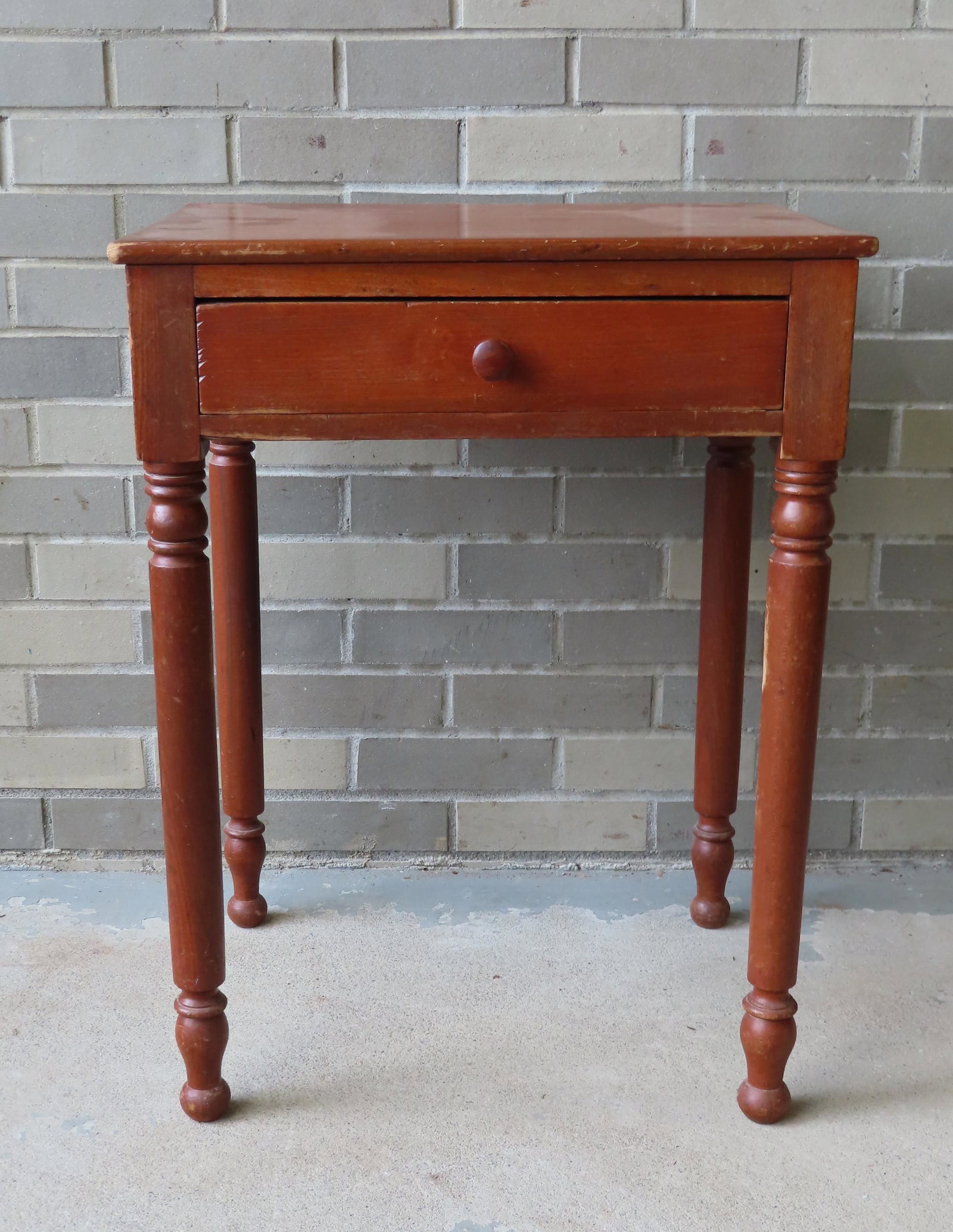 A one drawer Sheraton work table in poplar wood in red: A one drawer Sheraton work table in poplar wood in red stain, circa 1830. Some surface scratches, but overall good condition. 20 1/2" x 16" top x 27"H. Provenance: From a Long Island NY country estate