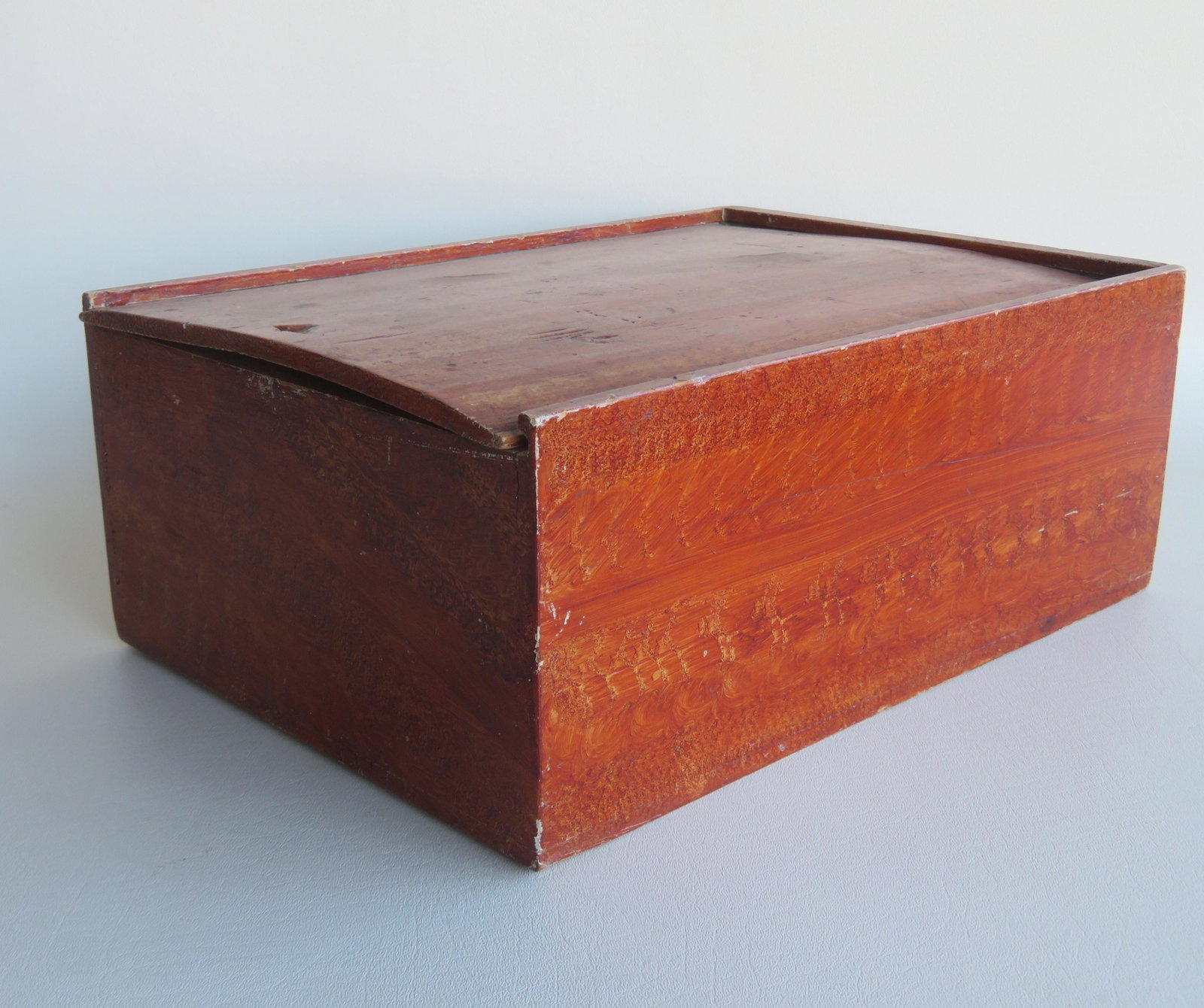 Grain painted slide lid candle box with wall papered: Grain painted slide lid candle box with wall papered interior, mid 19th century - 15"L x 10 3/4"D x 6"H. Good condition.