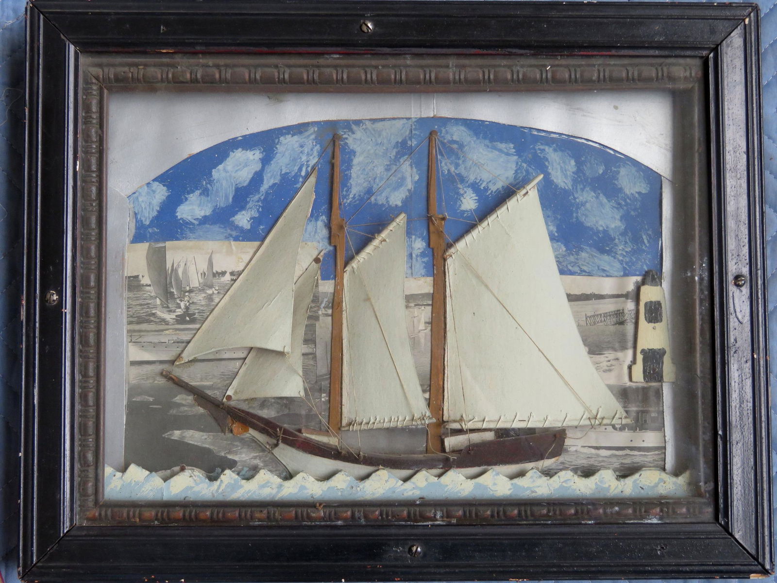A hand made 2 mast sailing ship diorama, fully rigged,: A hand made 2 mast sailing ship diorama, fully rigged, with hand painted cardboard sails and waves - the background in mixed media having a sky in water colors, images of other sailing ships in backgr