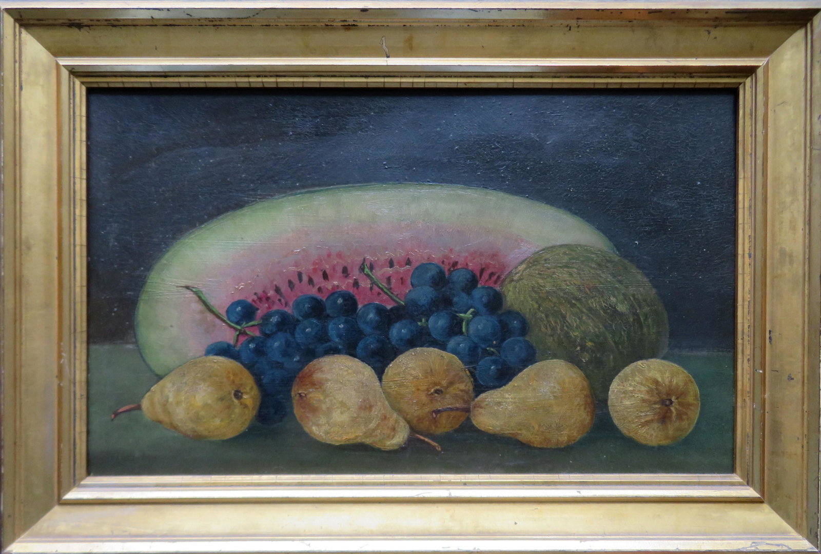 O/B Still life of watermelon, pears and grapes sitting: O/B Still life of watermelon, pears and grapes sitting on a table - 19th century - not signed. Mounted in a period lemon gold frame. All in very good condition. Total frame size 20 1/2" x 13 3/4".