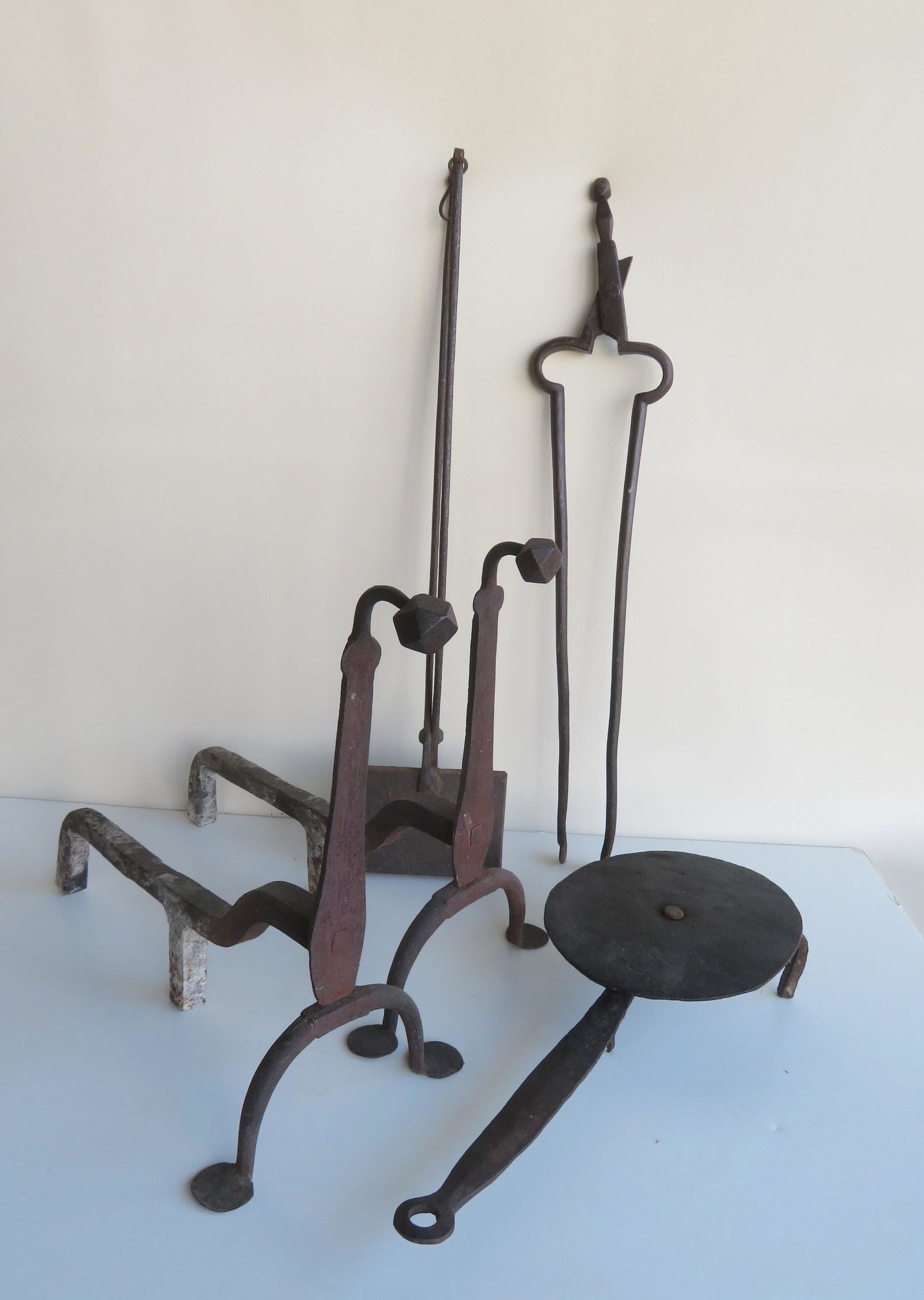 Four hand forged iron hearth items, 18th/19th century,: Four hand forged iron hearth items, 18th/19th century, including: A good pair of goose neck andirons with circular feet typical of Queen Ann period 18th century - 16 1/2"H x 10"W x 17 1/2"D - very goo