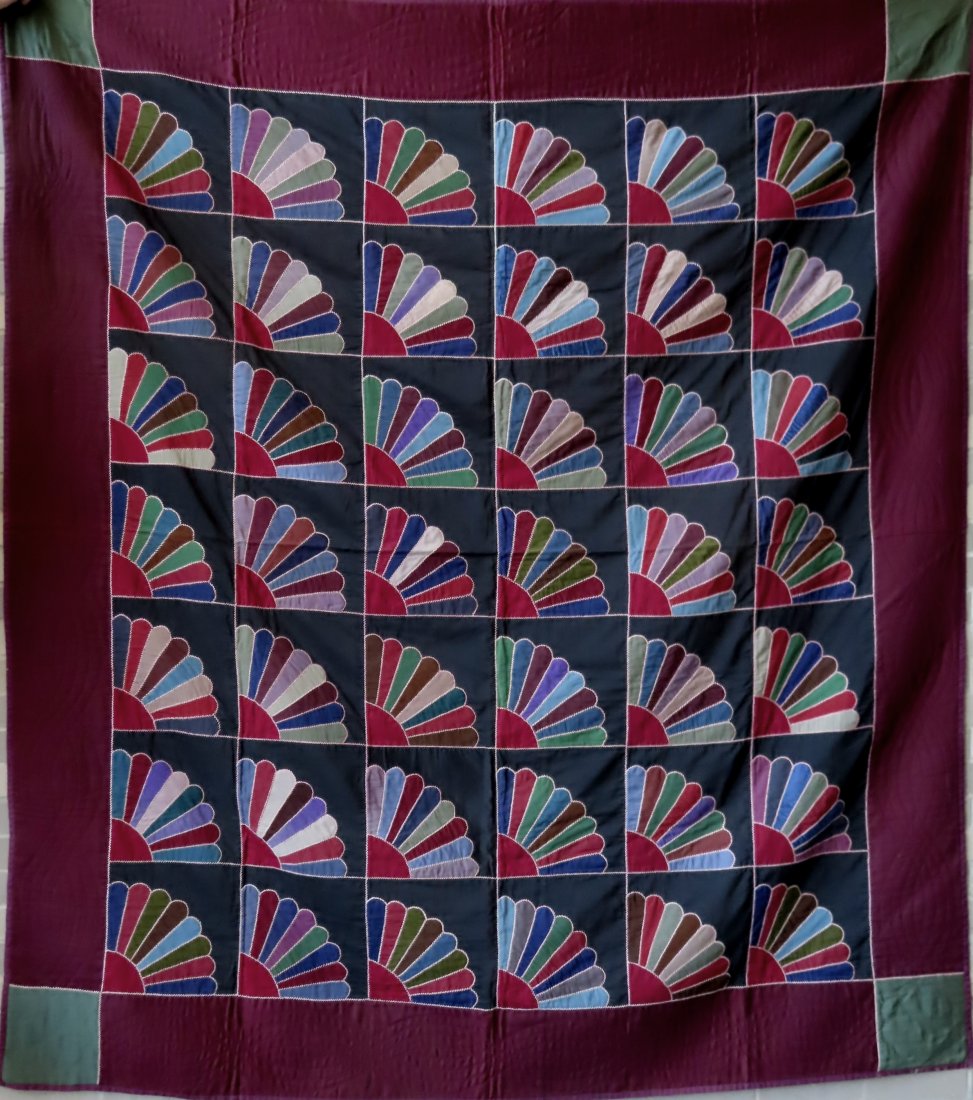 An exceptional Amish quilt in Fan pattern, circa 1940.: An exceptional Amish quilt, Lancaster Pa., in Fan pattern with wool fabrics, very fine hand sewn quilting, circa 1945 - very good condition. The colorful fans within black squares and having a dark ma