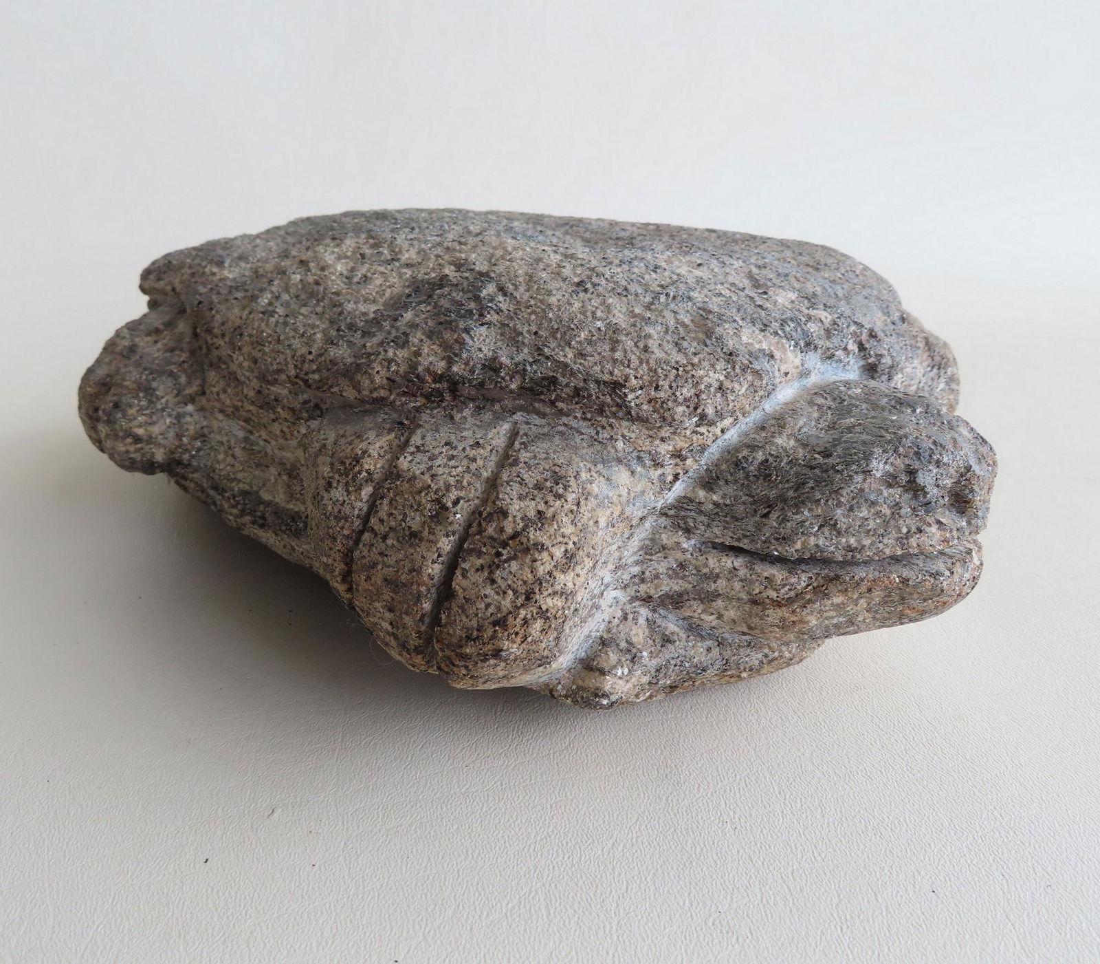 A carved stone figural garden turtle, probably granite,: A carved stone figural garden turtle, probably granite, early 20th century. Some use wear but overall good condition. Measures 13"L x 8"W x 4"H.