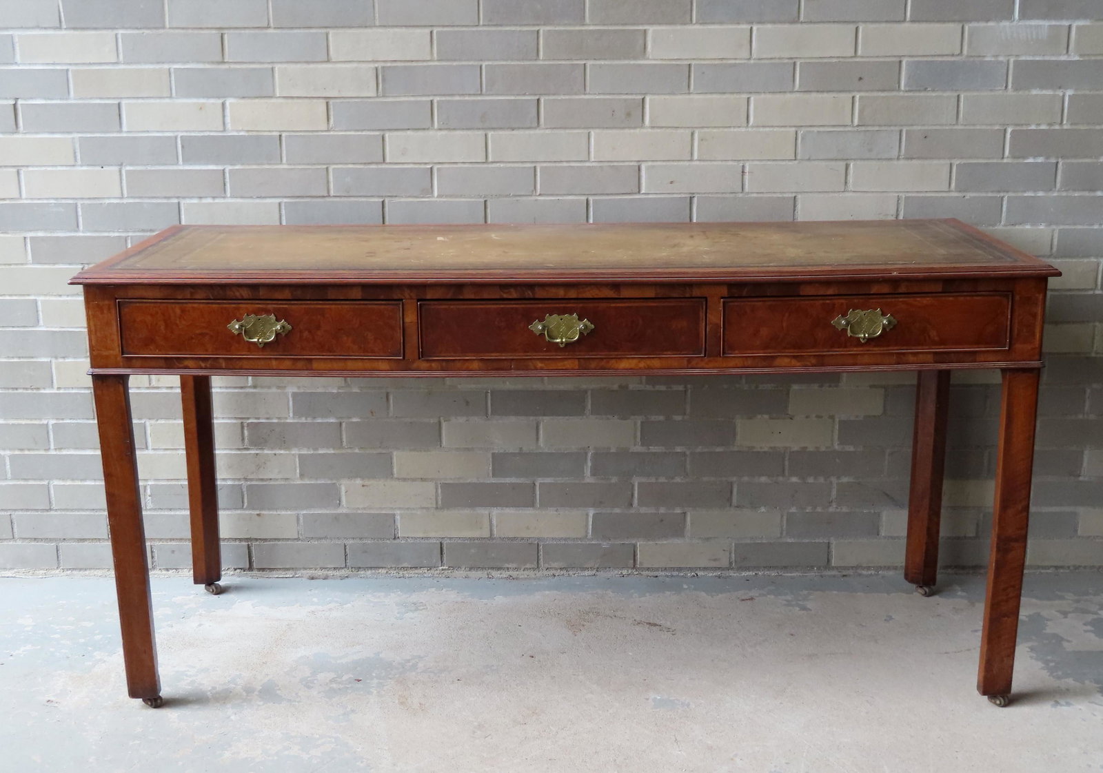 A Chippendale burled walnut desk with a newer tooled: A Chippendale burled walnut desk with a newer tooled leather top, 3 drawers with beaded edges, chamfered and beaded legs, and geometric inlays. Replaced pulls, some restoration to drawer runners, but 