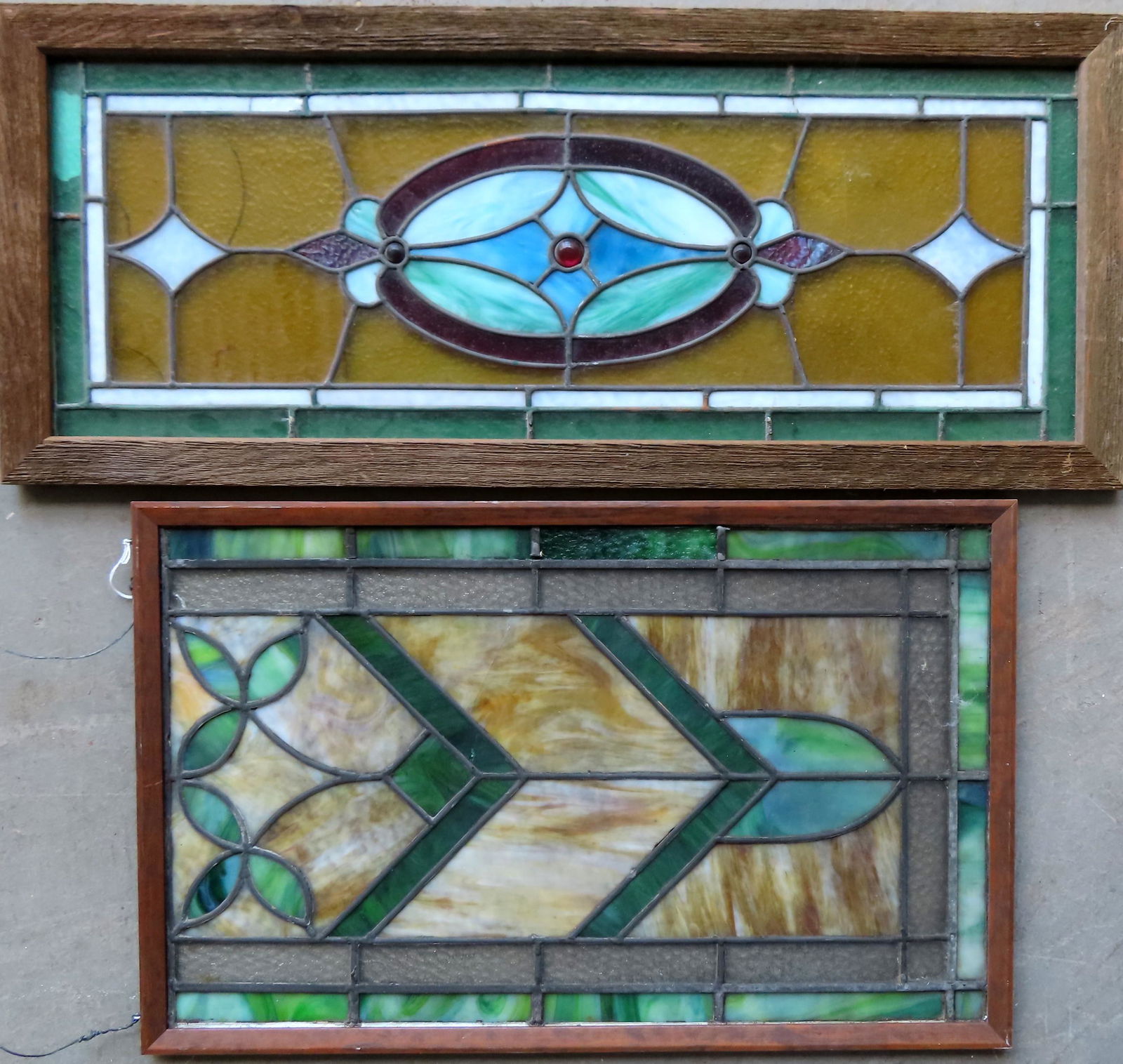 Two leaded and stained glass windows in the Art Deco: Two leaded and stained glass windows in the Art Deco style, circa 1920-30. The first with a crack in one pane otherwise very good condition - 14 1/2" x 34 1/2"; and the second with 4 glass sections wi