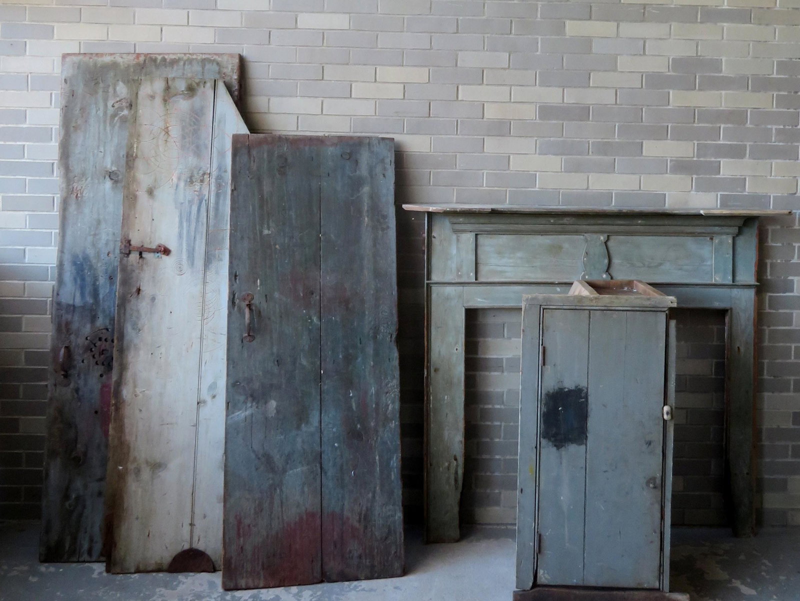 A fire place mantle with built in cupboard and doors.: A fire place mantle with built in cupboard and doors. To be updated