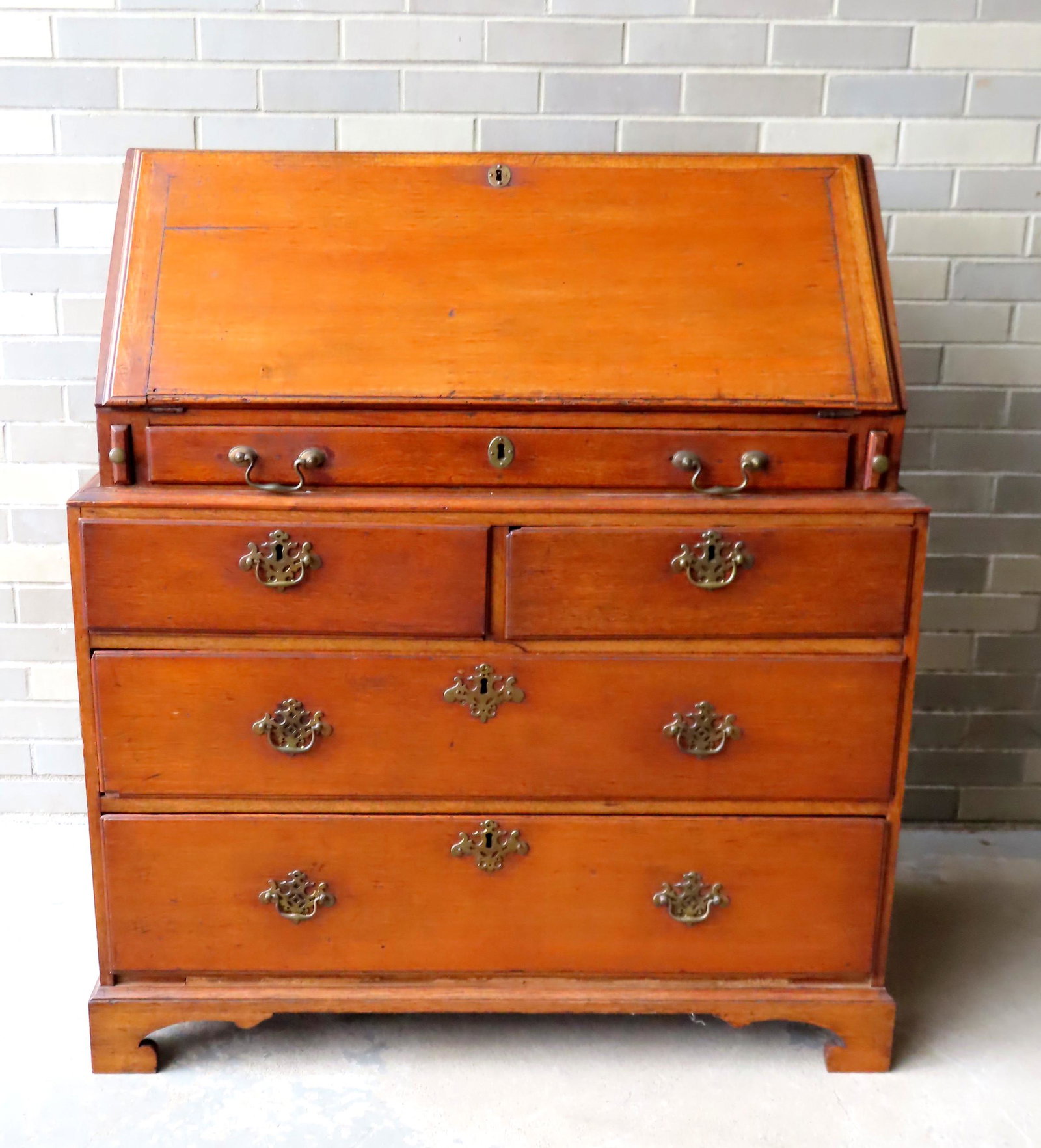 Unusual Chippendale oak slant front desk on chest,: Unusual Chippendale oak slant front desk on chest, probably English 18th century. The desk with drop front with molded edge, fitted interior with 8 drawers, flanking a central compartment with door ho