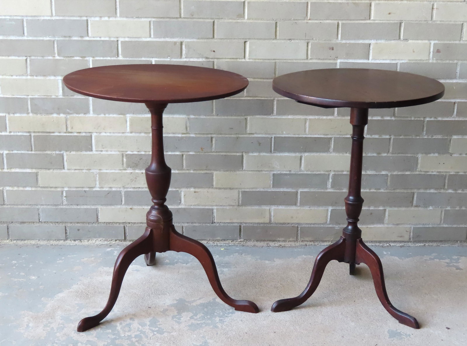 Two period American cherry Queen Ann tilt-top: Two period American cherry Queen Ann tilt-top candlestands with minor repairs, probably New England, Late 18th century. The first with round top, urn shaped turned column over snake feet - original ha