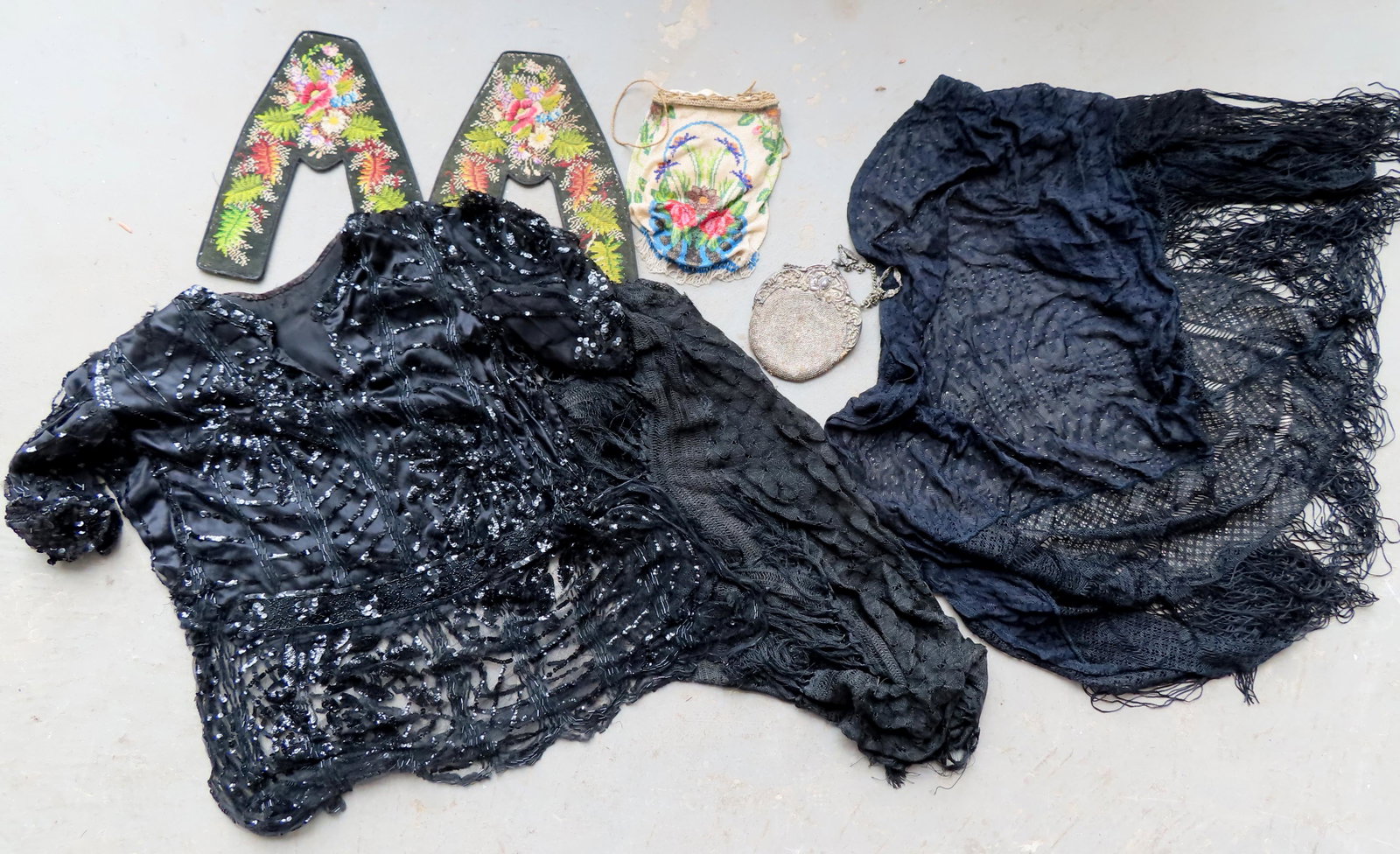 A grouping of ladies textiles including: A beaded silk: A grouping of ladies textiles including: A beaded silk dress with sequins, 1920's, some bead and sequin losses, but overall good condition; a black lace shawl, 19th century, some breaks in lace, but o