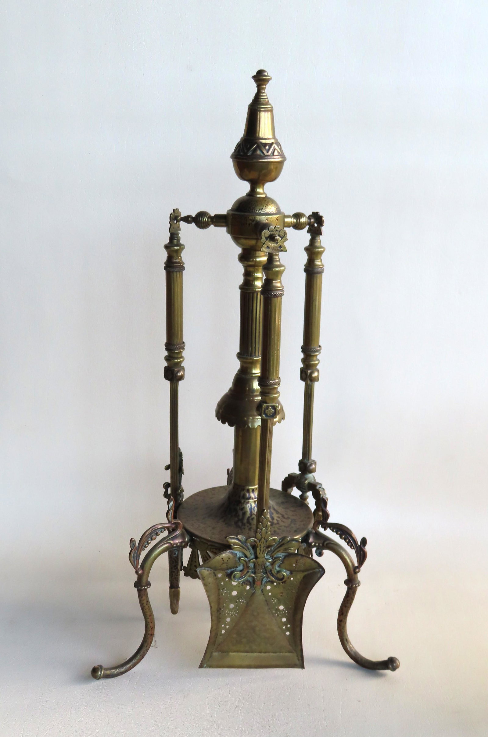 An exceptional set of ornate brass Persian revival: An exceptional set of ornate brass Persian revival fireplace tools, 19th century, consisting of shovel, tongs, and poker on matching stand, American, all hand made in very good condition. The stand me