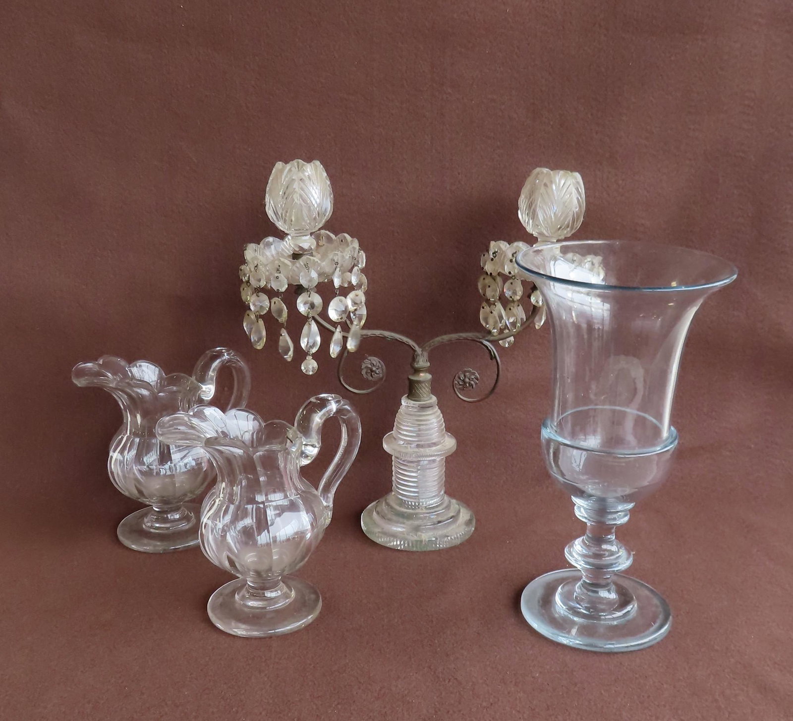 A grouping of 4 piece of early glass including: A: A grouping of 4 piece of early glass including: A double arm brass and glass candelabra, early to mid 19th century - missing some prisms, else good condition - 12"W x 14"H; a hand blown flint glass be