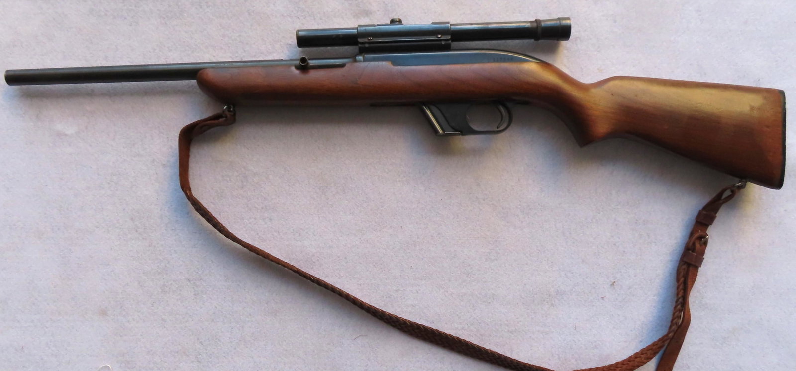 Winchester 22 caliber LR semi-automatic, Model 77: Winchester 22 caliber LR semi-automatic, Model 77 rifle. Good condition with working action and 1 magazine. A Weaver sight has been added to the rifle. Barrel length measures 16 1/4" and overall lengt