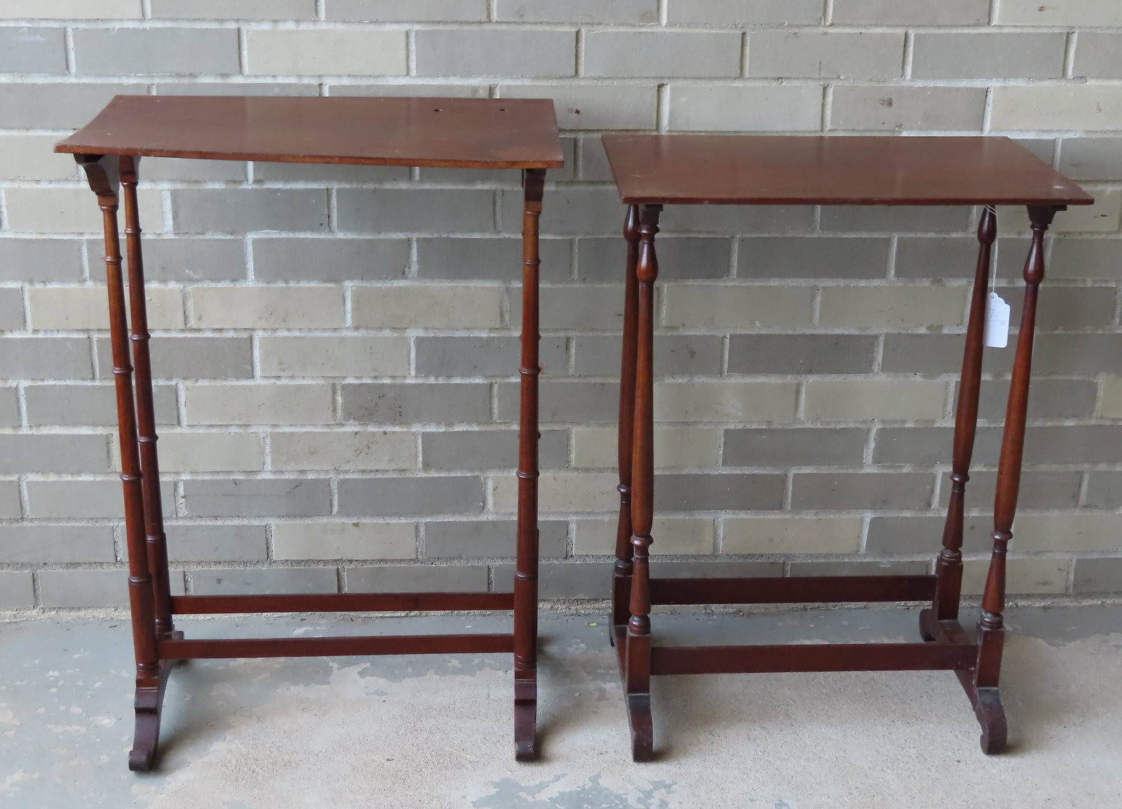 Two mahogany non-matching stacking tables from (from: Two mahogany non-matching stacking tables from (from sets), one with faux bamboo turnings and scrolled-up feet in the manner of Duncan Phyfe - two small holes in top, otherwise good condition - 20 3/4