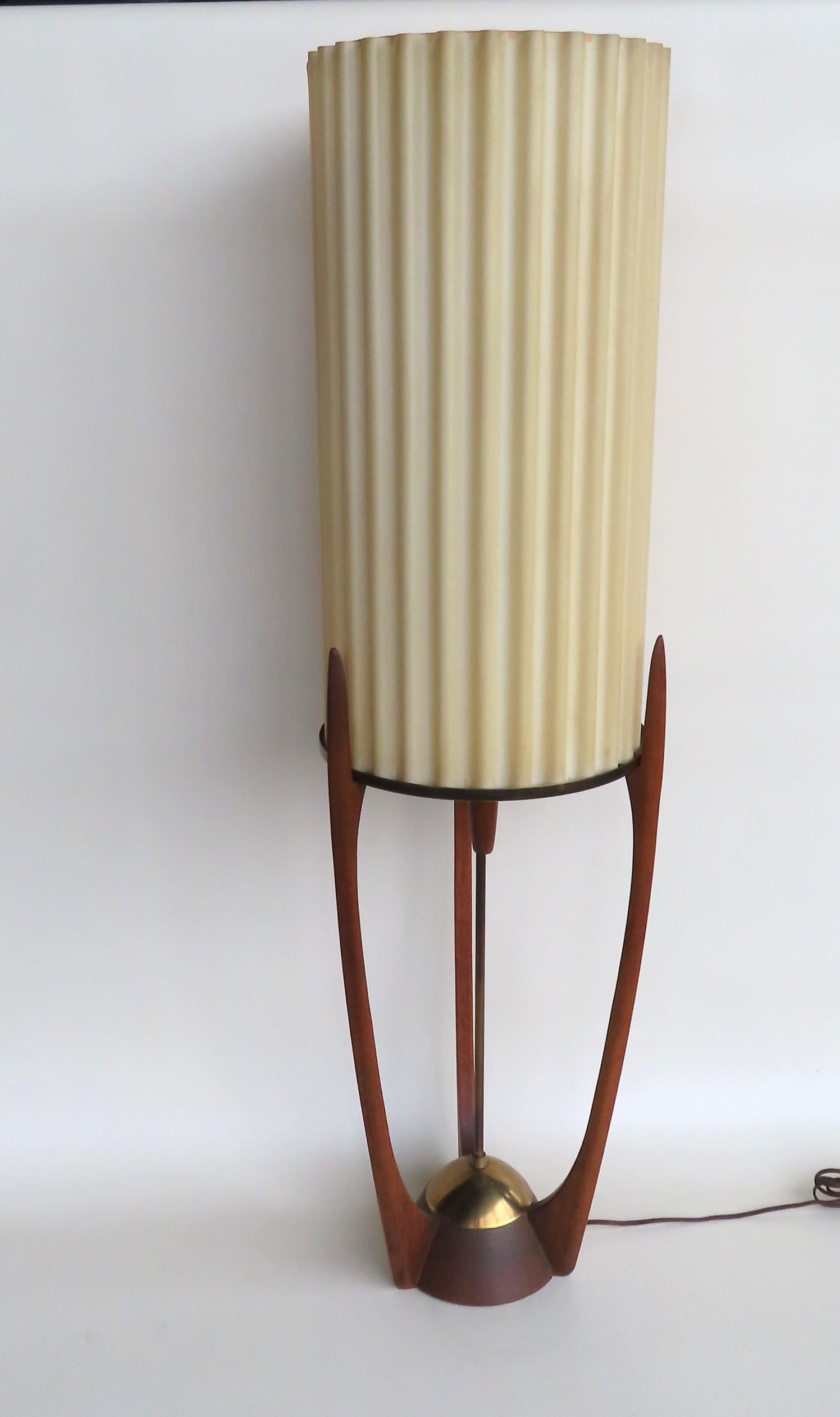 An unusual Modeline Co. of California, Danish modern: An unusual Modeline Co. of California, Danish modern walnut table lamp with a celluloid-type fluted shade, in very good condition. The on/off switch being a sliding walnut cylindrical handle mounted o