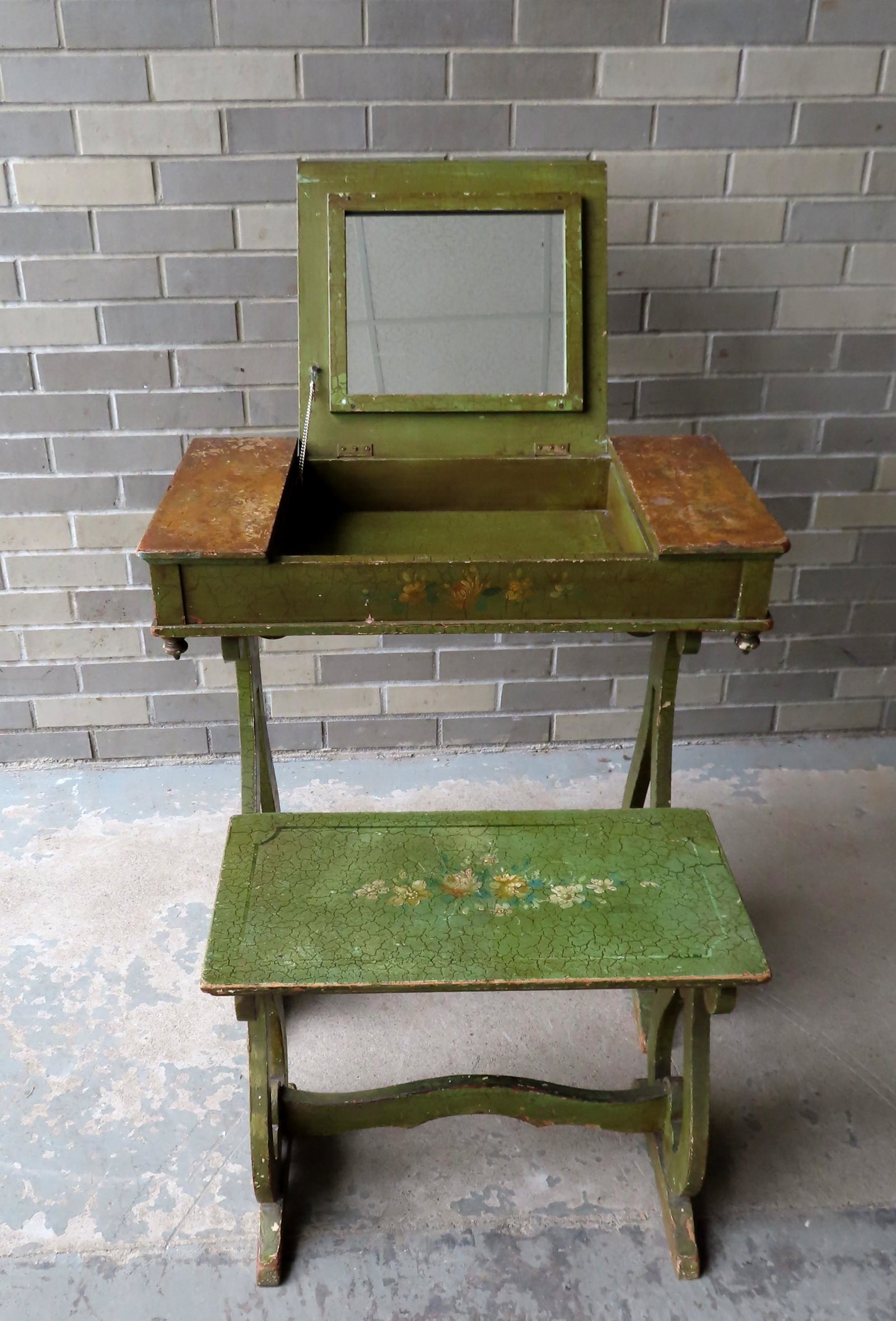 Petite paint decorated lady's vanity with matching: Petite paint decorated lady's vanity with matching stool. The top in 3 sections and including a central compartment with mirror flanked by 2 side divided compartments - the legs are scrolled in the fo