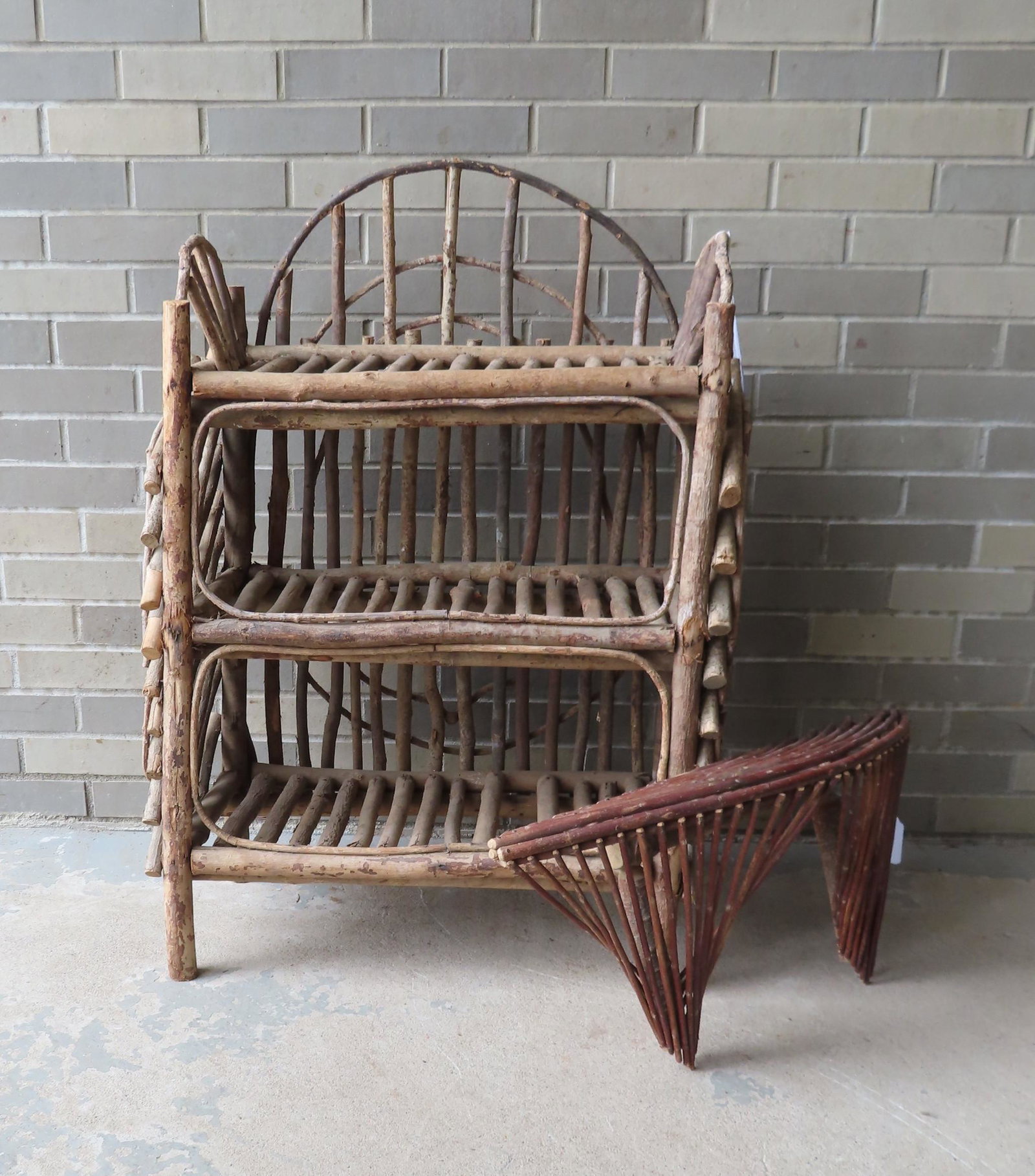 Two rustic twig work open shelf units including: A 3: Two rustic twig work open shelf units including: A 3 tier floor standing shelf - 38"H x 26"W x 13"D; and a bow front wall shelf - 28"W x 7"D x 13"H. Both in very good condition, mid 20th century.