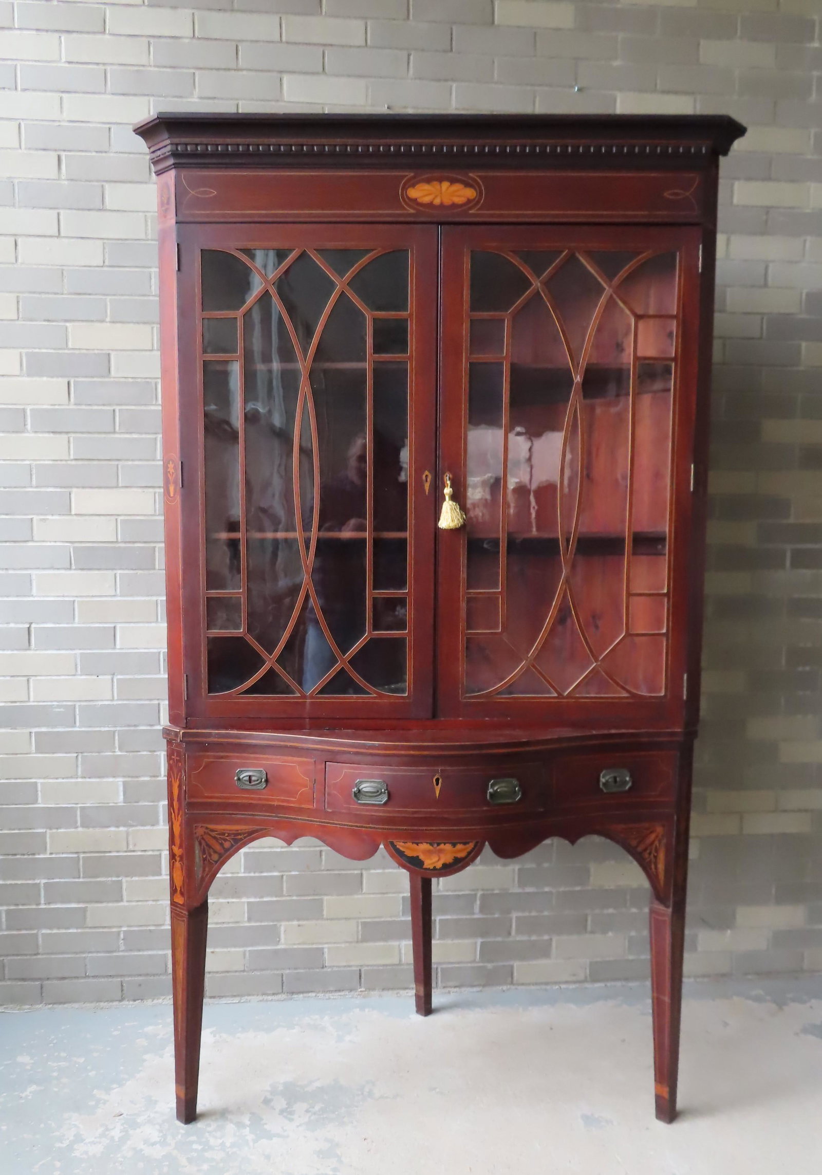 A good 2 part Hepplewhite style mahogany 2 part corner: A good 2 part Hepplewhite style mahogany 2 part corner cupboard with remnants of Baltimore Maryland paper label on reverse (likely Charles F. Meislahn 1847-1935 - furniture restorer and cabinet maker 