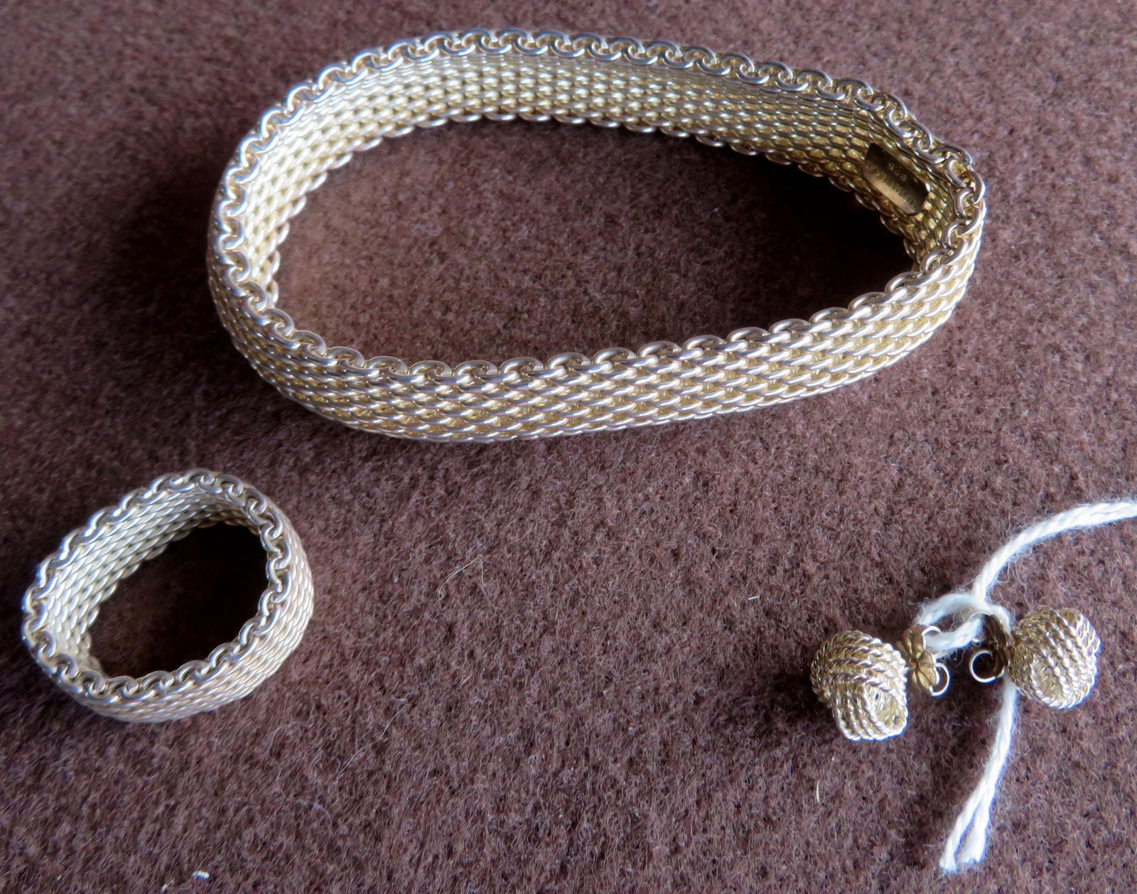 Tiffany & Co. sterling mesh bracelet, ring, and: Tiffany & Co. sterling mesh bracelet, ring, and earrings. All in excellent condition with original Tiffany pouches. Both in very good condition. NOTE - All jewelry and watches are guaranteed as descri