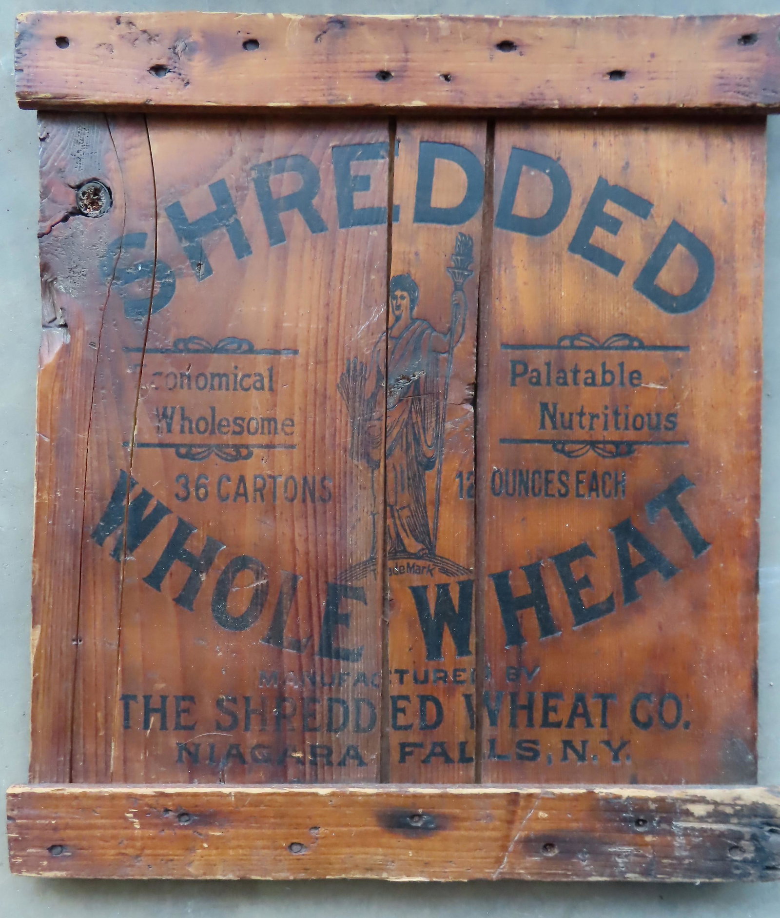 An advertisement on wood planks marked "Shredded Whole: An advertisement on wood planks marked "Shredded Whole Wheat", probably the end of a shipping crate, late 19th to early 20th century. 16" x 18". Good condition.