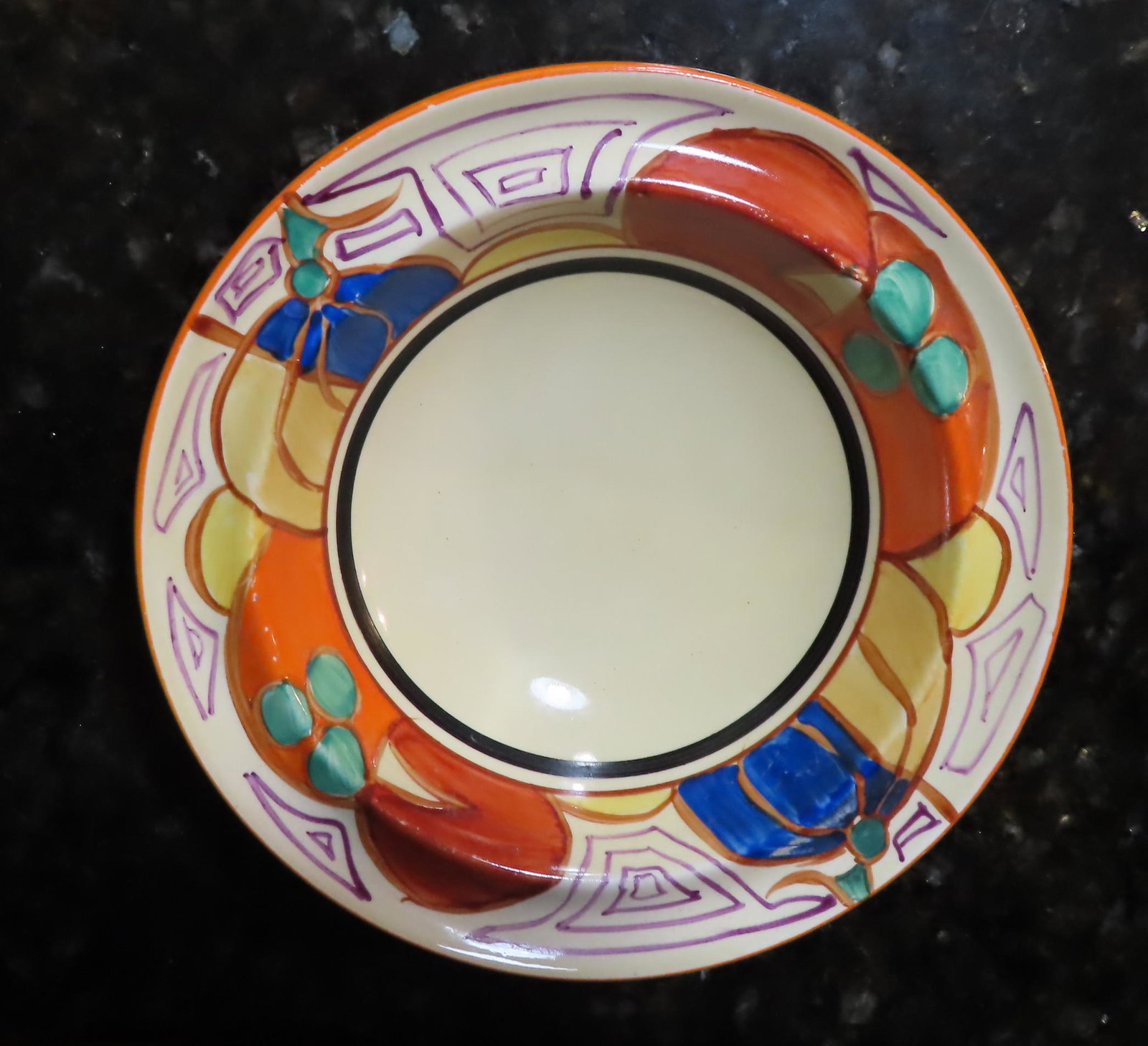 A small Clarice Cliff bowl in Fantasque pattern.: A small Clarice Cliff bowl in Fantasque pattern, all hand painted, very good condition - no damage or repairs. 6 3/8\" diameter x 1 1/2\"H.