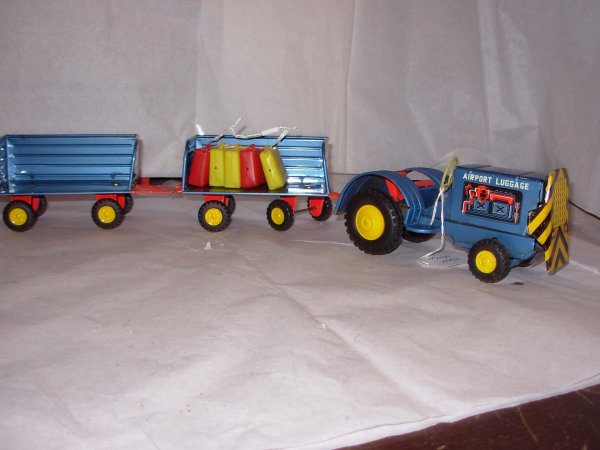 Japan tin friction, maybe (Craigston?) Airport lug: Japan tin friction, maybe (Craigston?) Airport luggage tractor with 2 trailers & luggage excl to mint cond